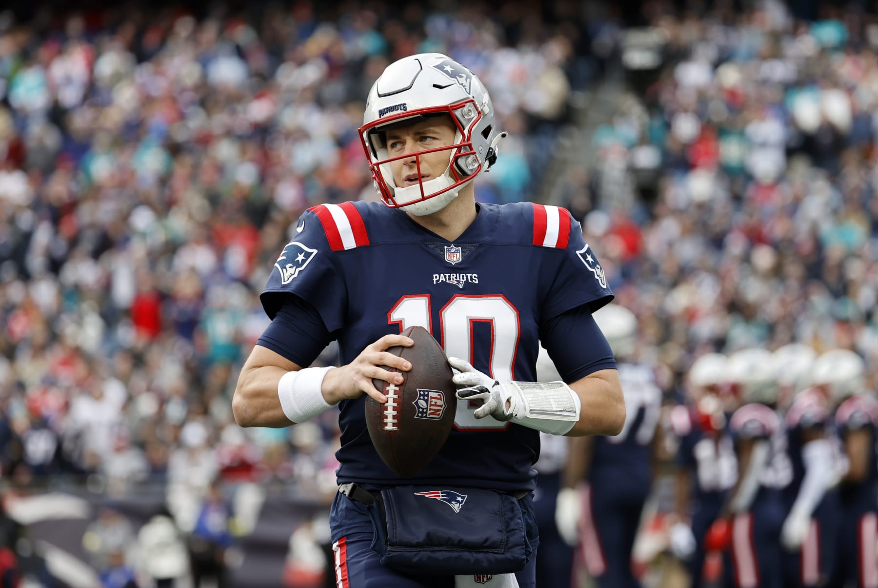 FOXBOROUGH, MA - JANUARY 01: New England Patriots quarterback Mac Jones (10) warms up through a tv timeout during a game between the New England Patriots and the Miami Dolphins on January 1, 2023, at Gillette Stadium in Foxboro, Massachusetts. (Photo by Fred Kfoury III/Icon Sportswire via Getty Images)