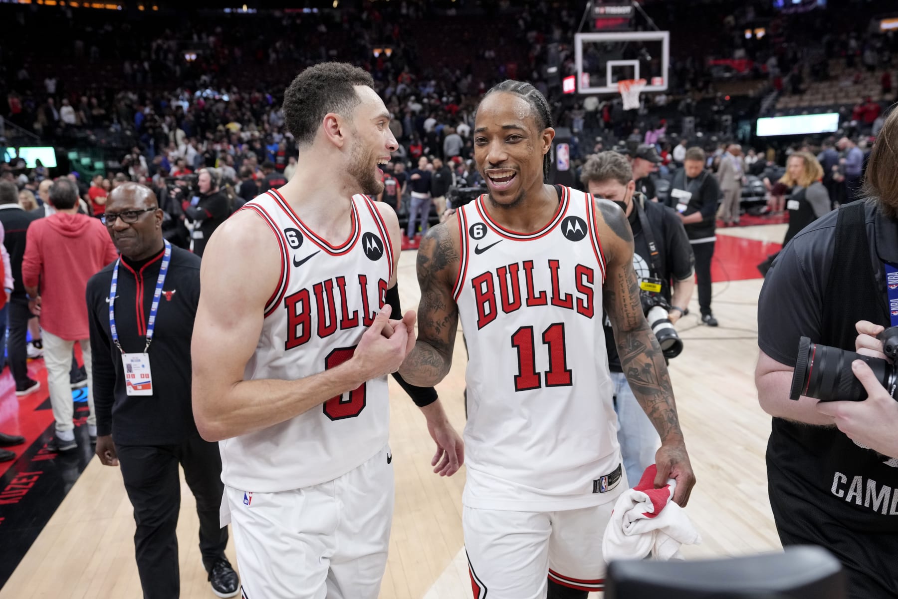 TORONTO, CANADA - APRIL 12:  DeMar DeRozan #11 and Zach LaVine #8 of the Chicago Bulls smile after the game against the Toronto Raptors during the 2023 Play-In Tournament on April 12, 2023 at the Scotiabank Arena in Toronto, Ontario, Canada.  NOTE TO USER: User expressly acknowledges and agrees that, by downloading and or using this Photograph, user is consenting to the terms and conditions of the Getty Images License Agreement.  Mandatory Copyright Notice: Copyright 2022 NBAE (Photo by Mark Blinch/NBAE via Getty Images)