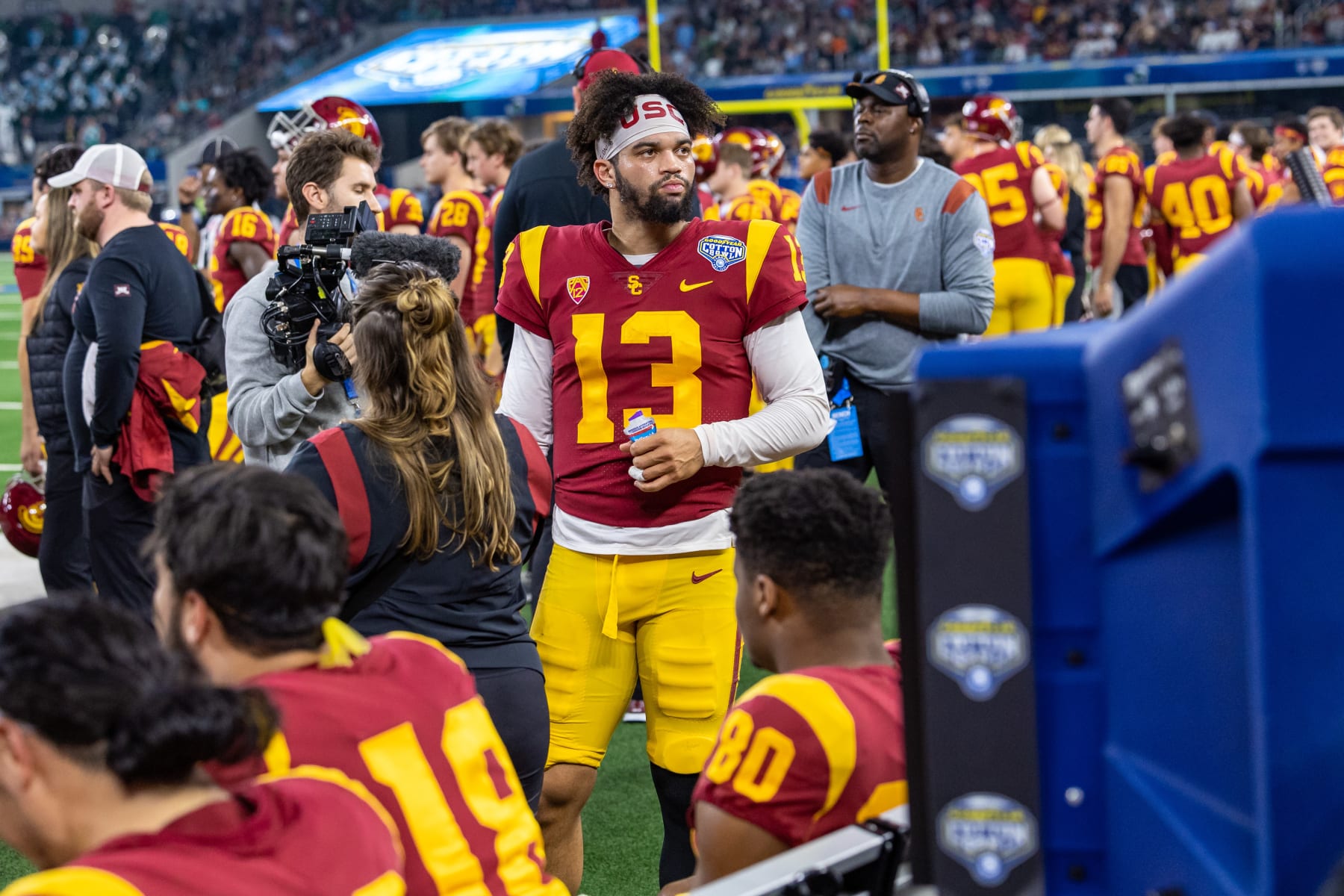 ARLINGTON, TX - JANUARY 02: USC Trojans quarterback Caleb Williams (#13) takes a break on the sideline during the Goodyear Cotton Bowl game between the USC Trojans and Tulane Green Wave on January 02, 2023 at AT&T Stadium in Arlington, TX.  (Photo by Matthew Visinsky/Icon Sportswire via Getty Images)