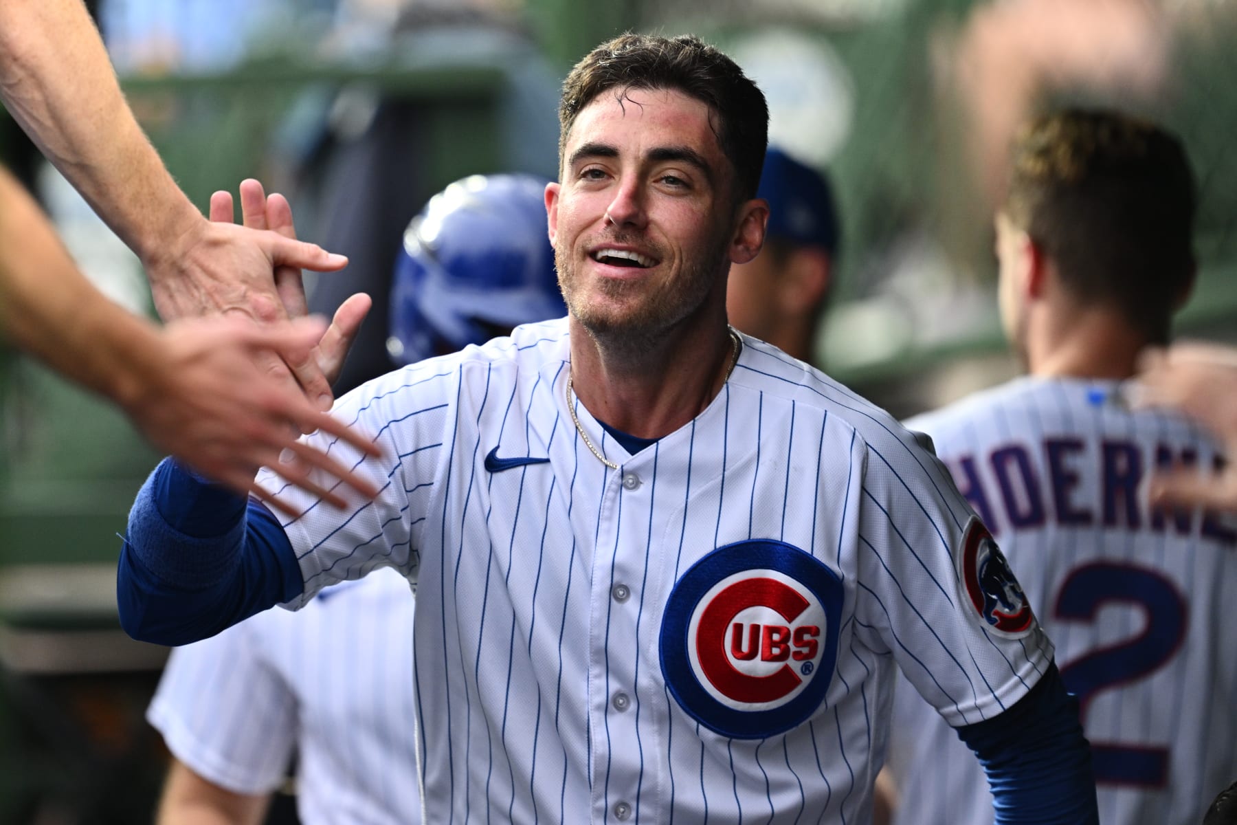 CHICAGO, IL - JUNE 29:  Cody Bellinger #24 of the Chicago Cubs celebrates in the dugout after scoring a run in the second inning against the Philadelphia Phillies at Wrigley Field on June 29, 2023 in Chicago, Illinois.  (Photo by Jamie Sabau/Getty Images)
