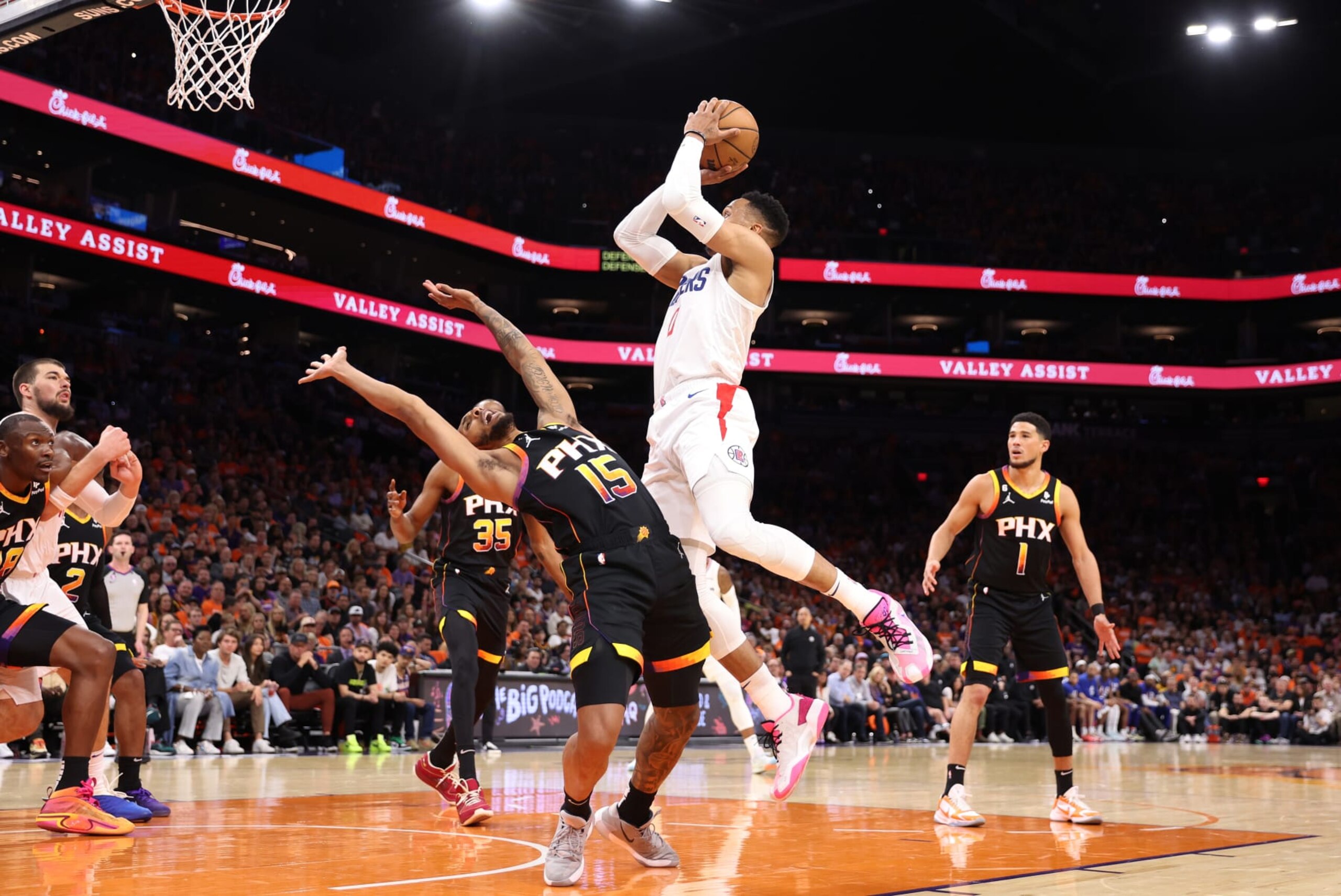 PHOENIX, ARIZONA - APRIL 25: Russell Westbrook #0 of the LA Clippers drives to the basket against Cameron Payne #15 of the Phoenix Suns during the second quarter in game five of the Western Conference First Round Playoffs at Footprint Center on April 25, 2023 in Phoenix, Arizona. NOTE TO USER: User expressly acknowledges and agrees that, by downloading and or using this photograph, User is consenting to the terms and conditions of the Getty Images License Agreement. (Photo by Christian Petersen/Getty Images)