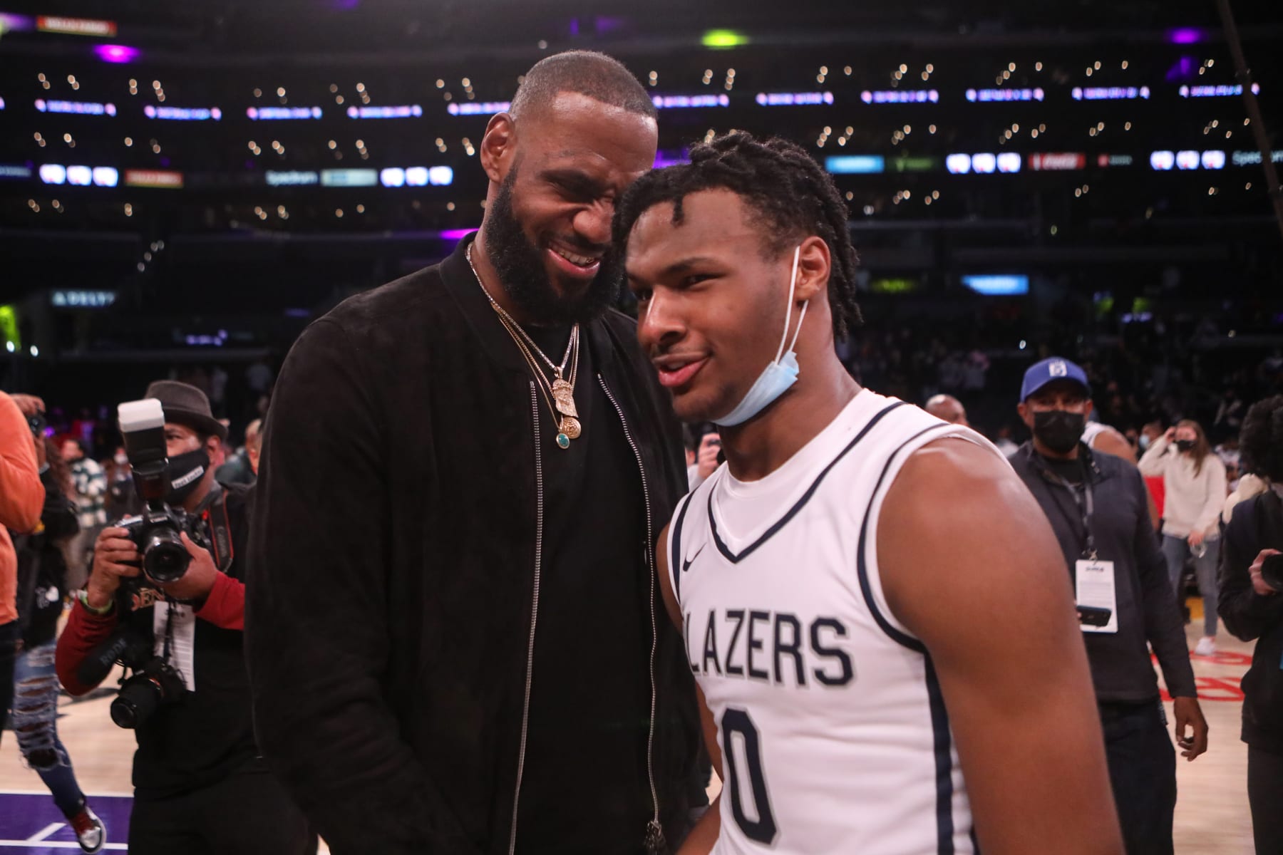 LOS ANGELES, CA - DECEMBER 04: Lebron James comes onto the court to congratulate his son Bronny James (0) point guard for Sierra Canyon after his team won against St. Vincent-St. Mary during The Chosen - 1's Invitational High School Basketball Showcase at the Staples Center on Saturday, Dec. 4, 2021 in Los Angeles, CA. (Jason Armond / Los Angeles Times via Getty Images) LOS ANGELES, CA - DECEMBER 04: Lebron James comes onto the court to congratulate his son Bronny James (0) point guard for Sierra Canyon after his team won against St. Vincent-St. Mary during The Chosen - 1's Invitational High School Basketball Showcase at the Staples Center on Saturday, Dec. 4, 2021 in Los Angeles, CA. (Jason Armond / Los Angeles Times via Getty Images)