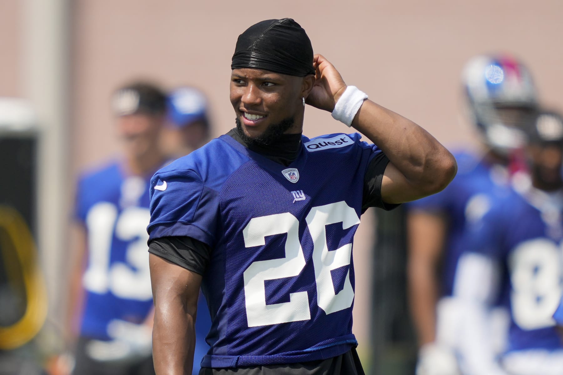 New York Giants running back Saquon Barkley participates in training drills at the NFL football team's practice facility, Wednesday, July 26, 2023, in East Rutherford, N.J. (AP Photo/John Minchillo)