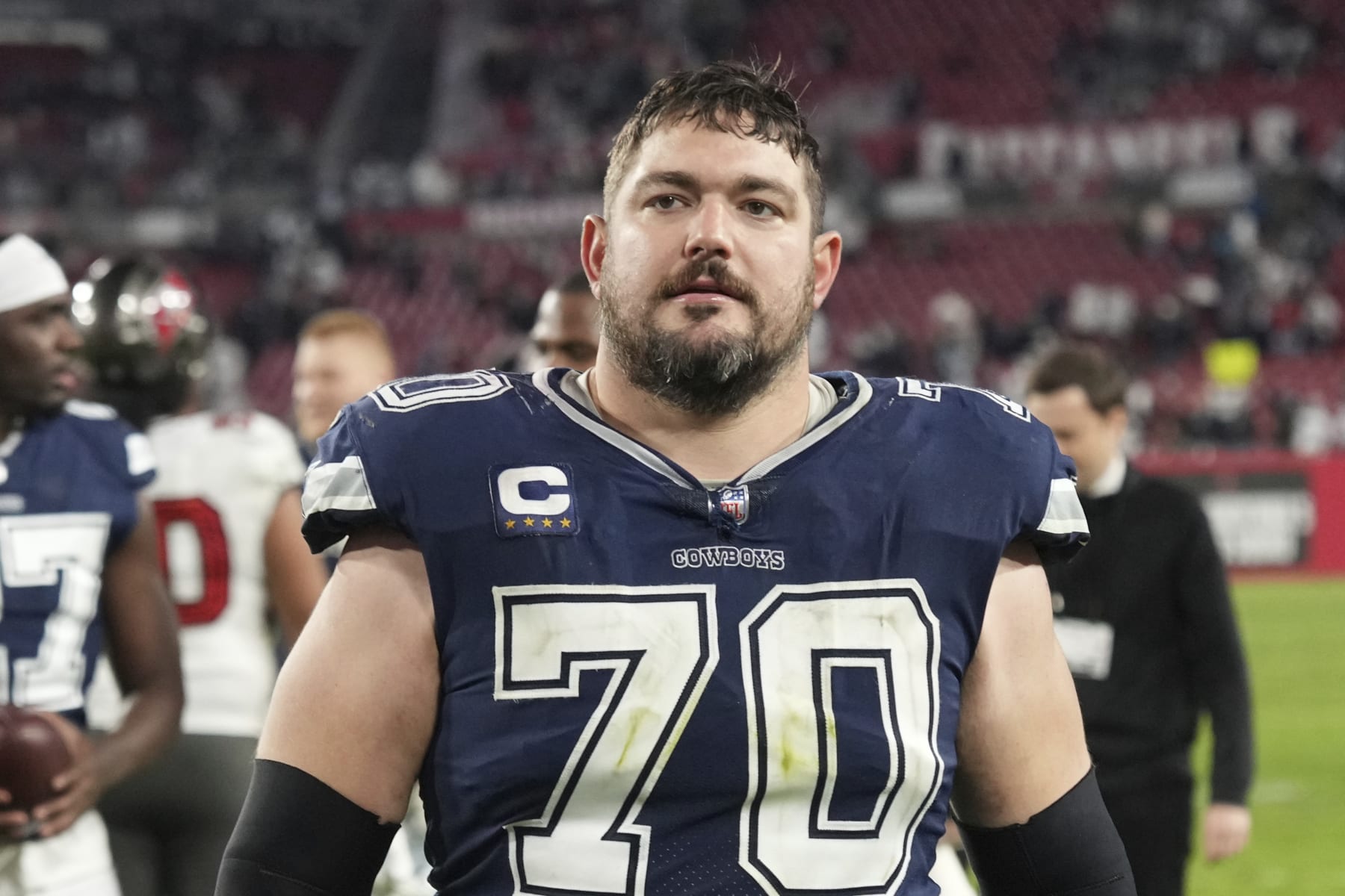 Dallas Cowboys guard Zack Martin (70) leaves the field following during an NFL wild-card football game against the Tampa Bay Buccaneers, Monday, Jan. 16, 2023, in Tampa, Fla. (AP Photo/Peter Joneleit)