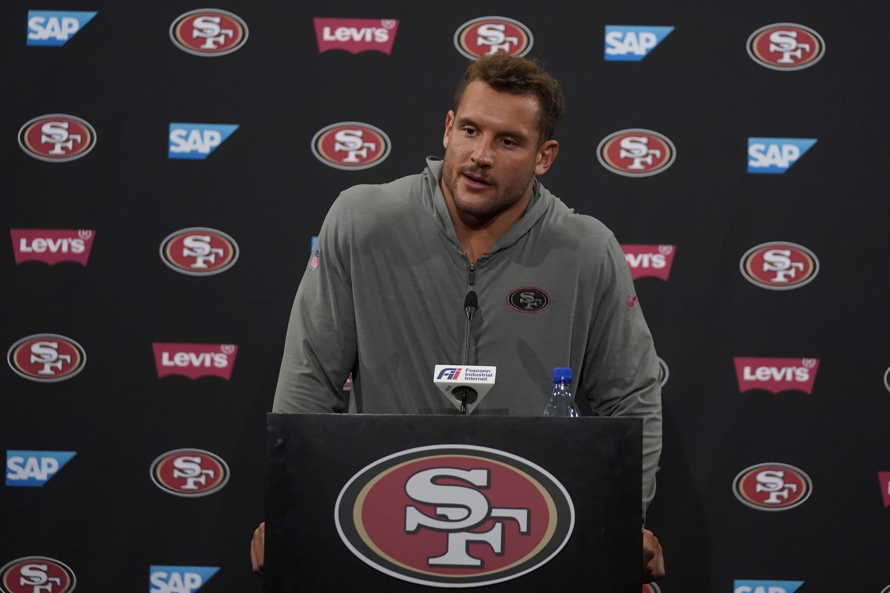 San Francisco 49ers' Nick Bosa speaks to reporters after an NFL football practice in Santa Clara, Calif., Tuesday, June 6, 2023. (AP Photo/Jeff Chiu)