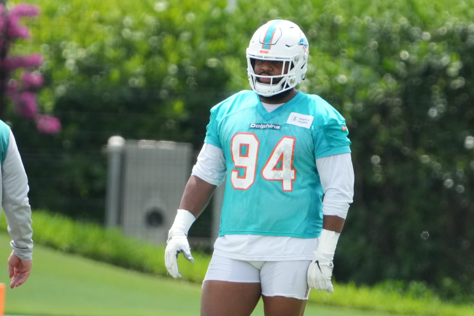MIAMI GARDENS, FL - JUNE 08: Miami Dolphins defensive tackle Christian Wilkins (94) listens to a coach during the Miami Dolphins OTA on Thursday, June 8, 2023 at Baptist Health Training Facility in Miami Gardens Fla. (Photo by Peter Joneleit/Icon Sportswire via Getty Images)