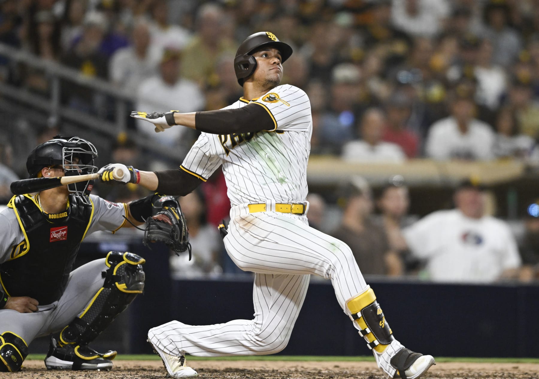 SAN DIEGO, CA - JULY 25:  Juan Soto #22 of the San Diego Padres hits a solo home run during the seventh inning of a baseball game against the Pittsburgh Pirates July 25, 2023 at Petco Park in San Diego, California. (Photo by Denis Poroy/Getty Images)