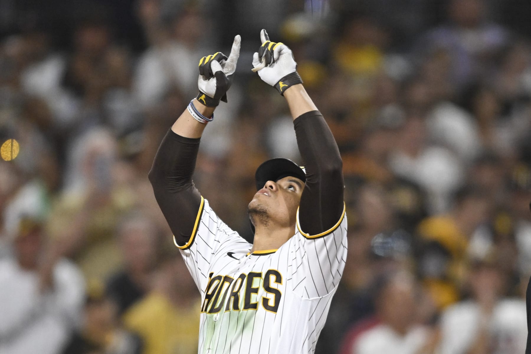SAN DIEGO, CA - JULY 25:  Juan Soto #22 of the San Diego Padres points skyward after hitting a solo home run during the seventh inning of a baseball game against the Pittsburgh Pirates July 25, 2023 at Petco Park in San Diego, California. (Photo by Denis Poroy/Getty Images)