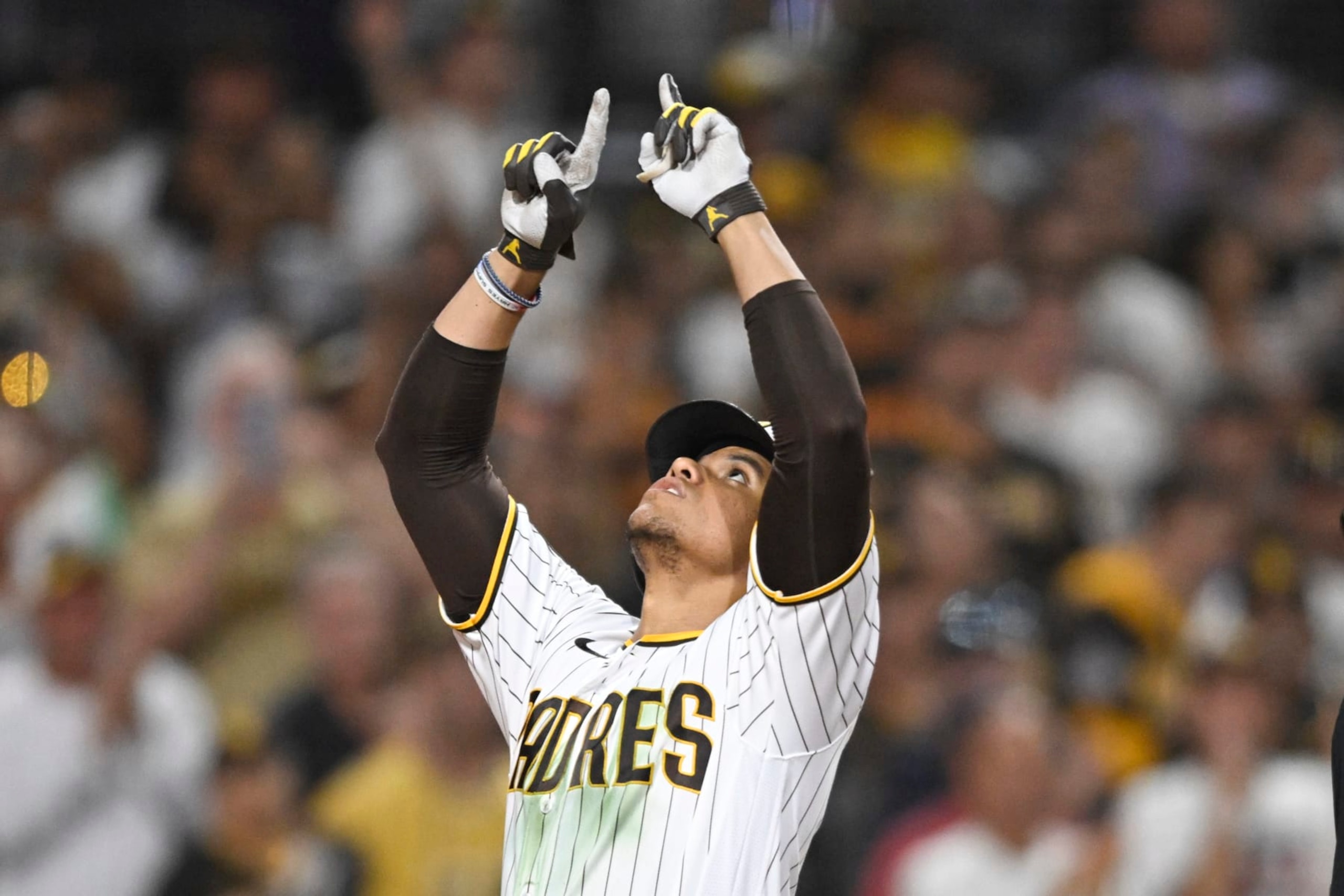 SAN DIEGO, CA - JULY 25:  Juan Soto #22 of the San Diego Padres points skyward after hitting a solo home run during the seventh inning of a baseball game against the Pittsburgh Pirates July 25, 2023 at Petco Park in San Diego, California. (Photo by Denis Poroy/Getty Images)