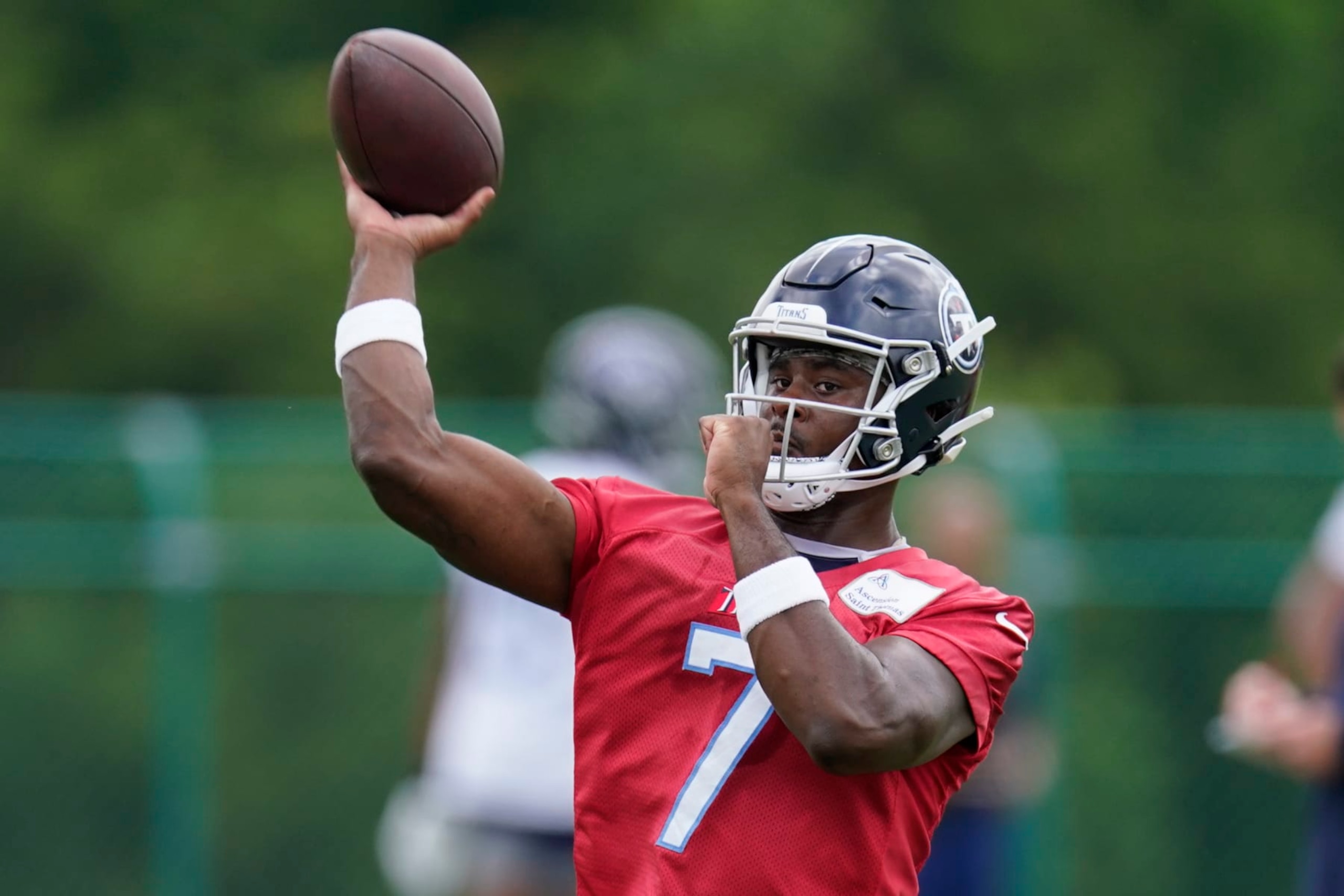 Tennessee Titans quarterback Malik Willis (7) throws a pass during NFL football practice Wednesday, May 31, 2023, in Nashville, Tenn. (AP Photo/George Walker IV)