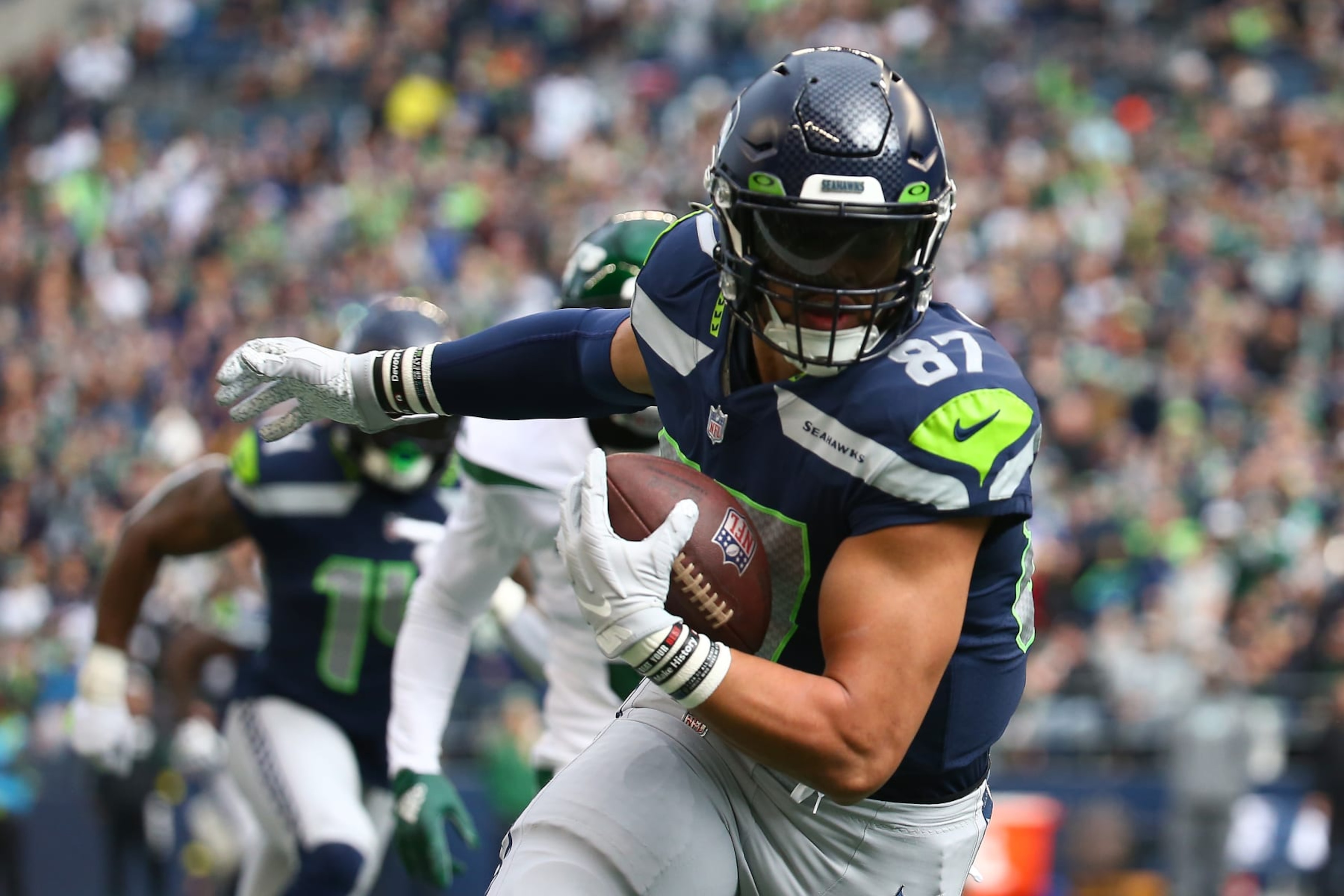SEATTLE, WASHINGTON - JANUARY 01: Noah Fant #87 of the Seattle Seahawks runs the ball after a catch during the first quarter in the game against the New York Jets at Lumen Field on January 01, 2023 in Seattle, Washington. (Photo by Lindsey Wasson/Getty Images) SEATTLE, WASHINGTON - JANUARY 01: Noah Fant #87 of the Seattle Seahawks runs the ball after a catch during the first quarter in the game against the New York Jets at Lumen Field on January 01, 2023 in Seattle, Washington. (Photo by Lindsey Wasson/Getty Images)