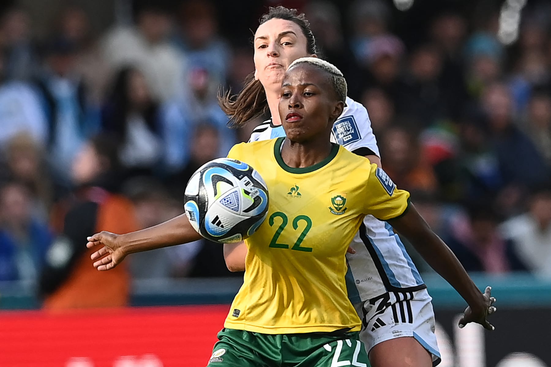 South Africa's midfielder #22 Mapula Kgoale (front) fights for the ball with Argentina's defender #13 Sophia Braun during the Australia and New Zealand 2023 Women's World Cup Group G football match between Argentina and South Africa at Dunedin Stadium in Dunedin on July 28, 2023. (Photo by Sanka Vidanagama / AFP) (Photo by SANKA VIDANAGAMA/AFP via Getty Images)