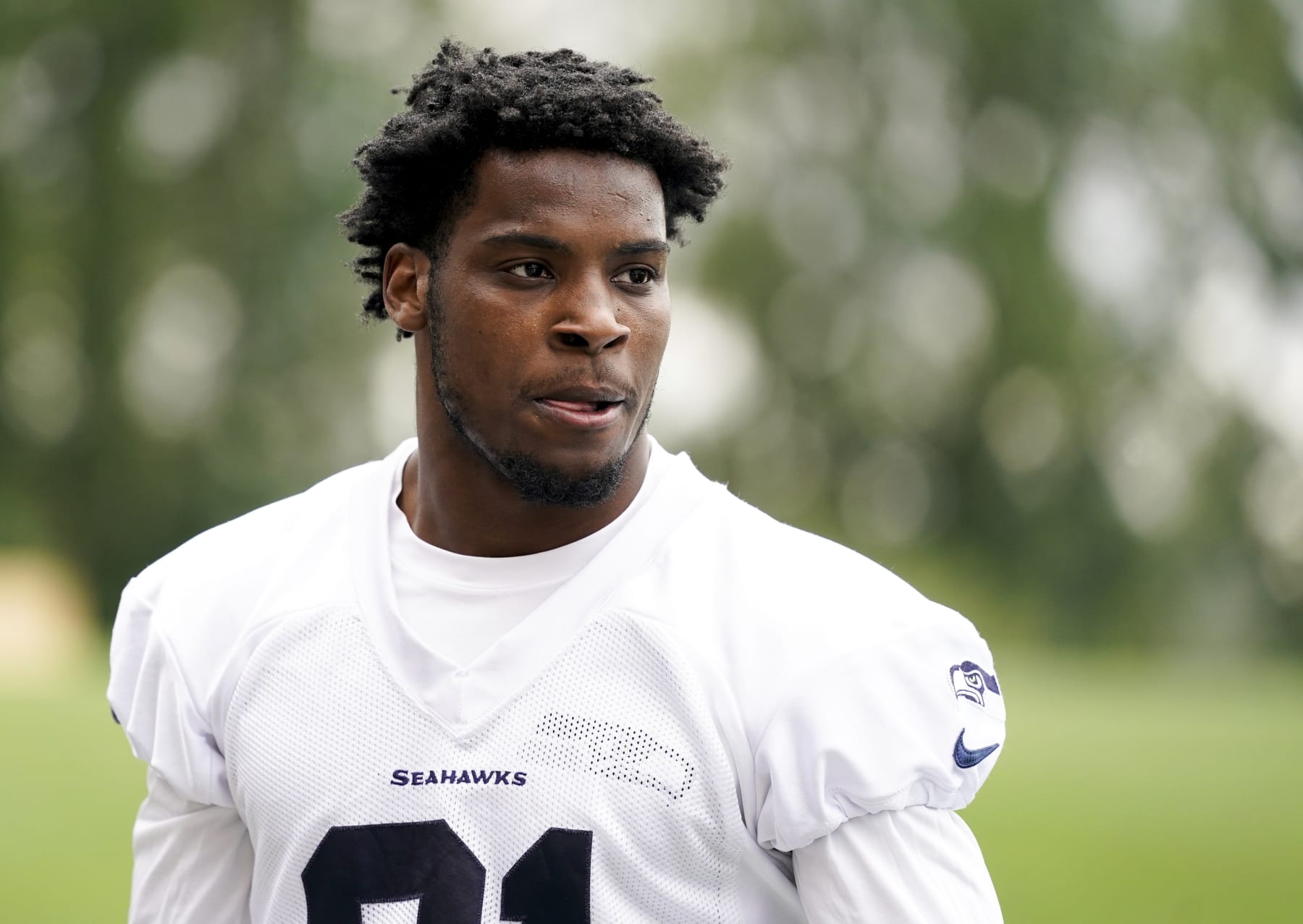 Seattle Seahawks cornerback Devon Witherspoon walks off the field after participating in drills, Monday, May 22, 2023, at the team's NFL football training facility in Renton, Wash. (AP Photo/Lindsey Wasson)
