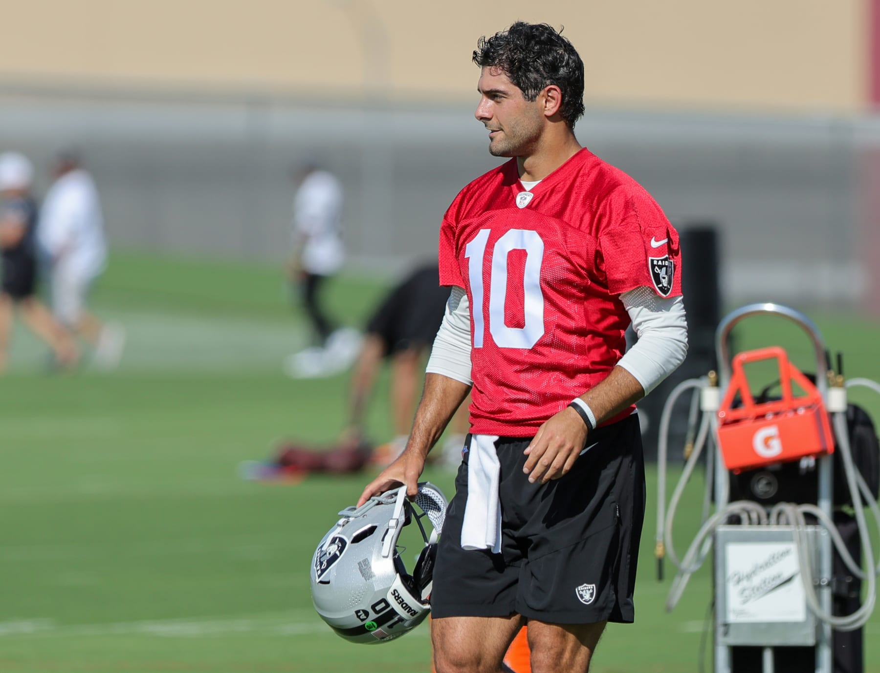 HENDERSON, NEVADA - JULY 26: Quarterback Jimmy Garoppolo #10 of the Las Vegas Raiders runs on a field during the first practice of the team's training camp at the Las Vegas Raiders Headquarters/Intermountain Healthcare Performance Center on July 26, 2023 in Henderson, Nevada. (Photo by Ethan Miller/Getty Images)