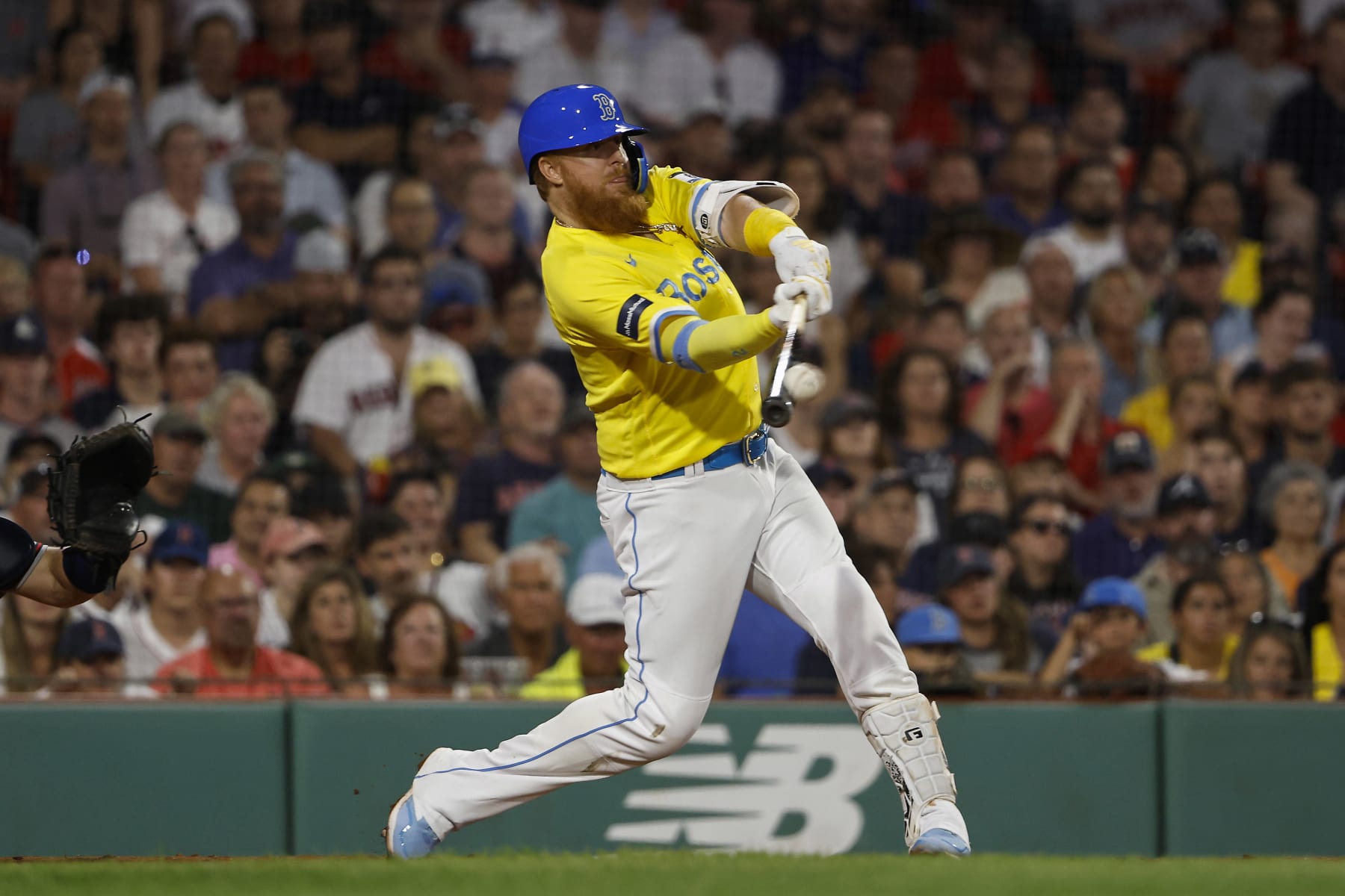 BOSTON, MA - JULY 26: Justin Turner #2 of the Boston Red Sox connects on a two-run double against the Atlanta Braves during the seventh inning at Fenway Park on July 26, 2023 in Boston, Massachusetts. (Photo By Winslow Townson/Getty Images)