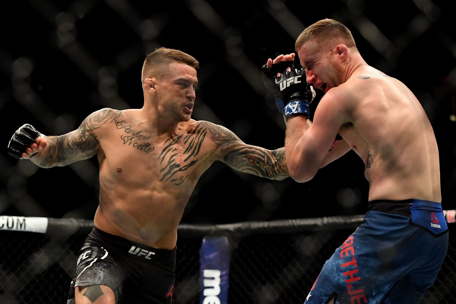 GLENDALE, AZ - APRIL 14:  (L-R) Dustin Poirier punches Justin Gaethje in their lightweight fight during the UFC Fight Night event at Gila River Arena on April 14, 2018 in Glendale, Arizona.  (Photo by Jennifer Stewart/Getty Images)