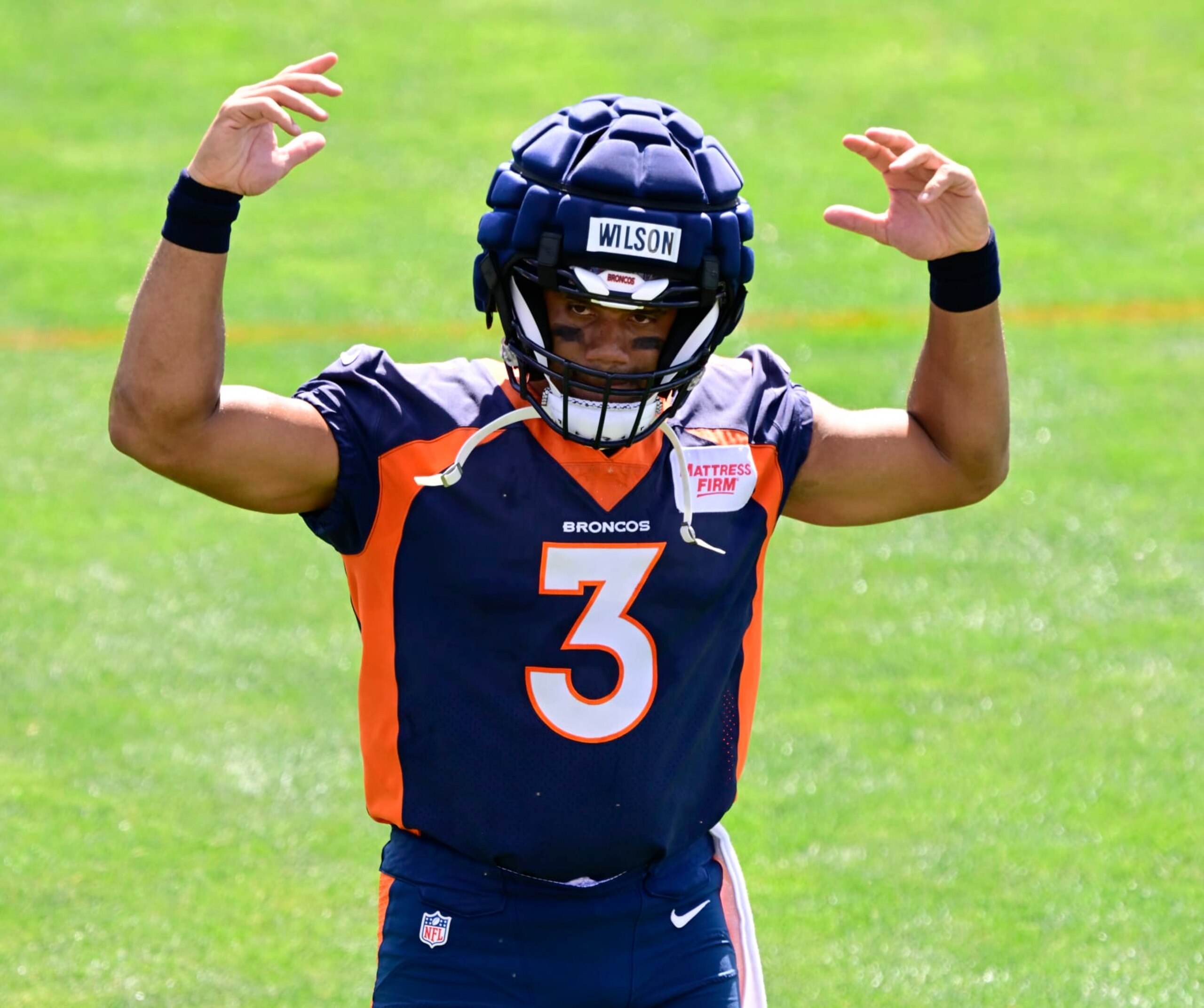 ENGLEWOOD, CO - JULY 28: Denver Broncos quarterback Russell Wilson (3) acknowledges the fans during training camp at Centura Health Training Center July 28, 2023. (Photo by Andy Cross/MediaNews Group/The Denver Post via Getty Images)