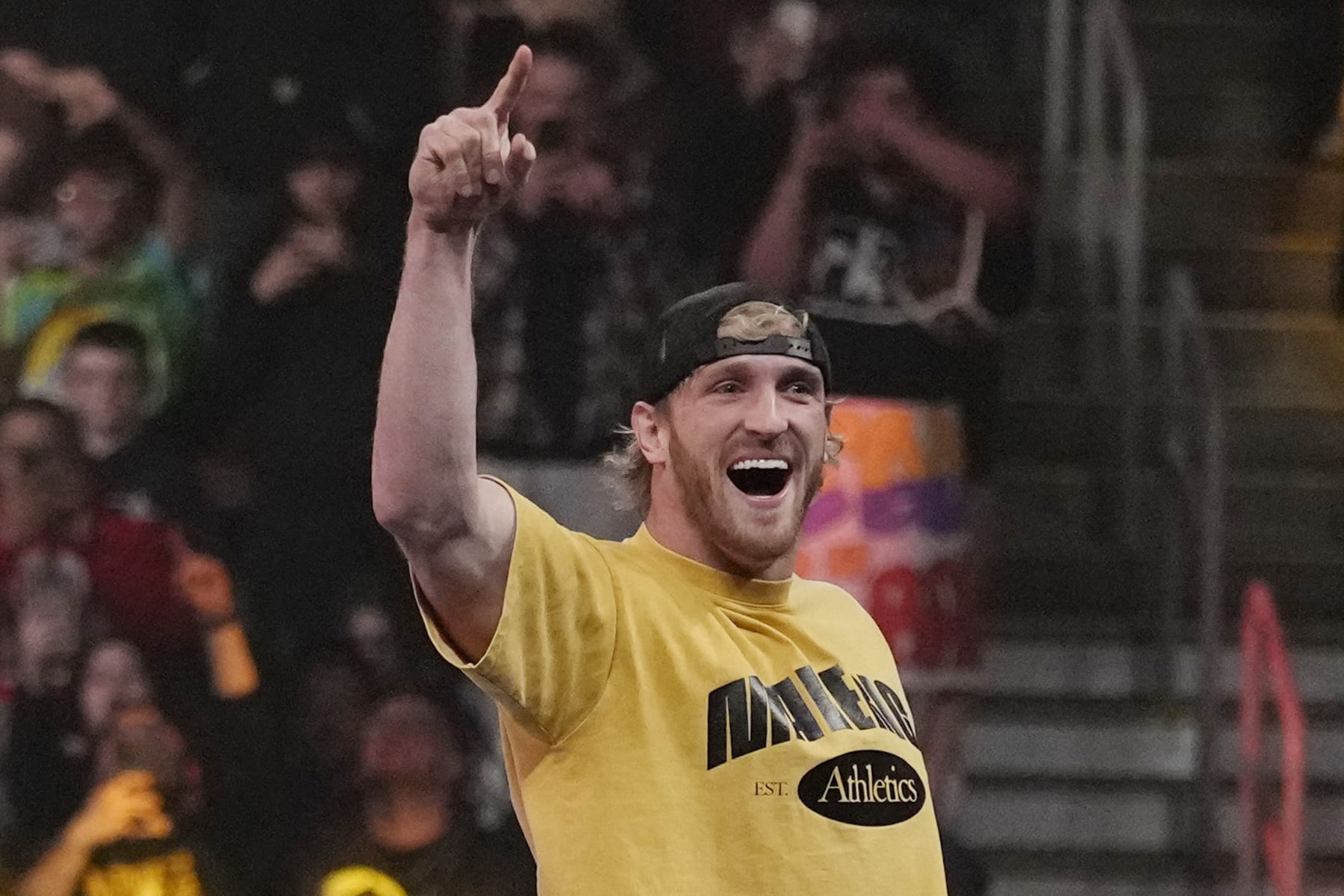 Fans cheer on wrestler Logan Paul during the WWE Monday Night RAW event, Monday, March 6, 2023, in Boston. (AP Photo/Charles Krupa)