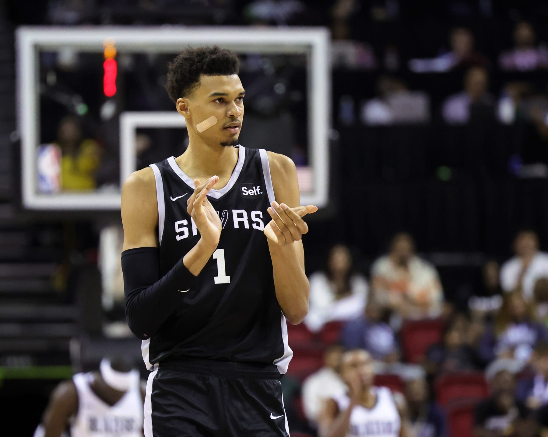 LAS VEGAS, NEVADA - JULY 09: Victor Wembanyama #1 of the San Antonio Spurs claps his hands as he walks on the court during a break in the second half of a 2023 NBA Summer League game against the Portland Trail Blazers at the Thomas & Mack Center on July 09, 2023 in Las Vegas, Nevada. NOTE TO USER: User expressly acknowledges and agrees that, by downloading and or using this photograph, User is consenting to the terms and conditions of the Getty Images License Agreement. (Photo by Ethan Miller/Getty Images)