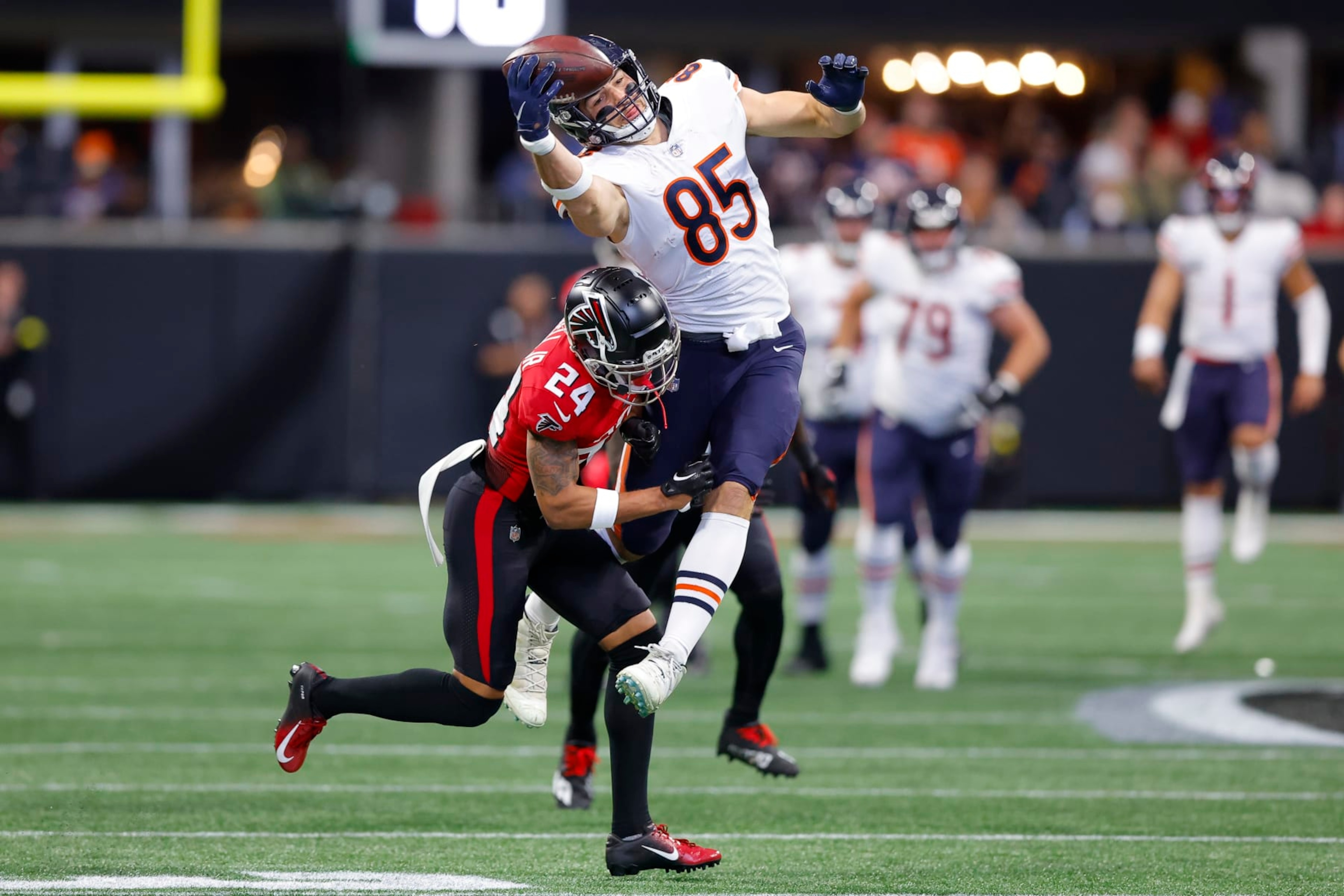 ATLANTA, GA - NOVEMBER 20: Cole Kmet #85 of the Chicago Bears makes a one handed catch against A.J. Terrell #24 of the Atlanta Falcons during the first half at Mercedes-Benz Stadium on November 20, 2022 in Atlanta, Georgia. (Photo by Todd Kirkland/Getty Images)