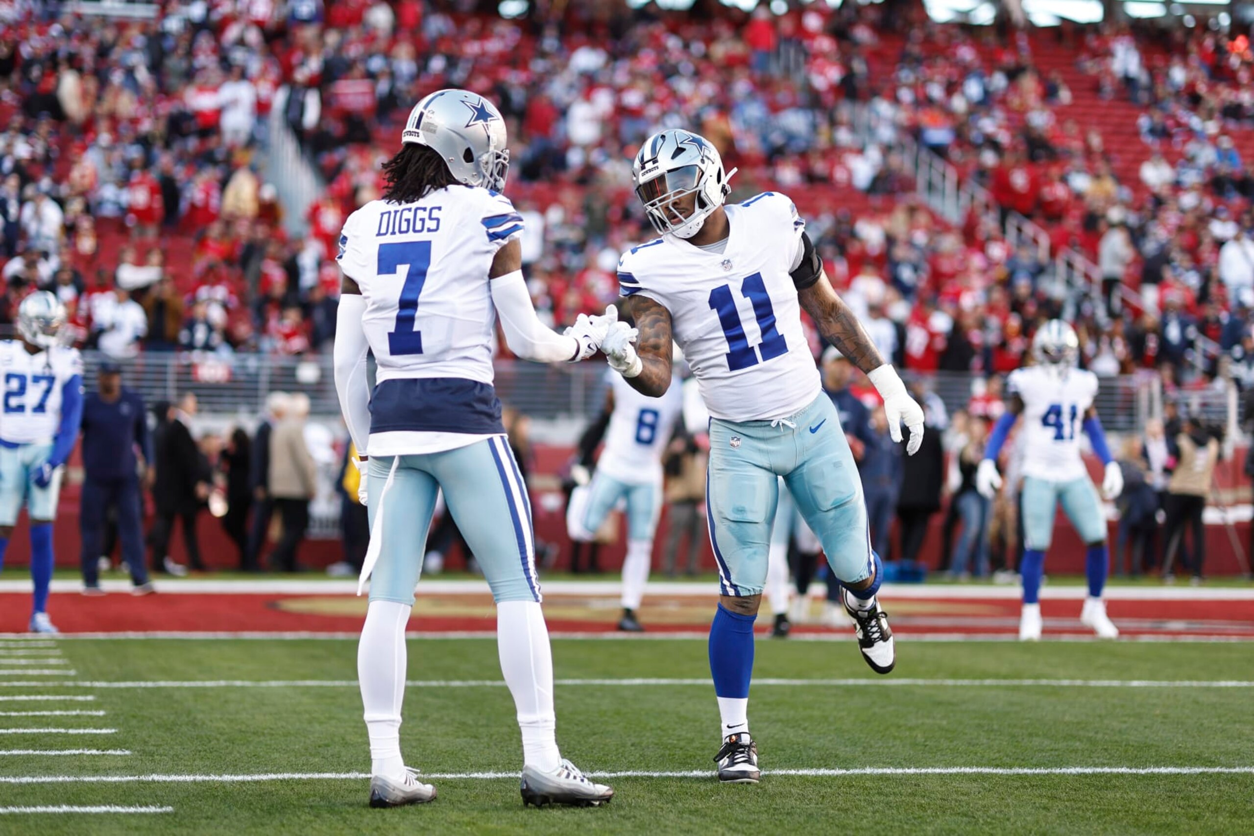 SANTA CLARA, CALIFORNIA - JANUARY 22: Micah Parsons #11 of the Dallas Cowboys shakes hands with Trevon Diggs #7 of the Dallas Cowboys prior to an NFL divisional round playoff football game between the San Francisco 49ers and the Dallas Cowboys at Levi's Stadium on January 22, 2023 in Santa Clara, California. (Photo by Michael Owens/Getty Images)
