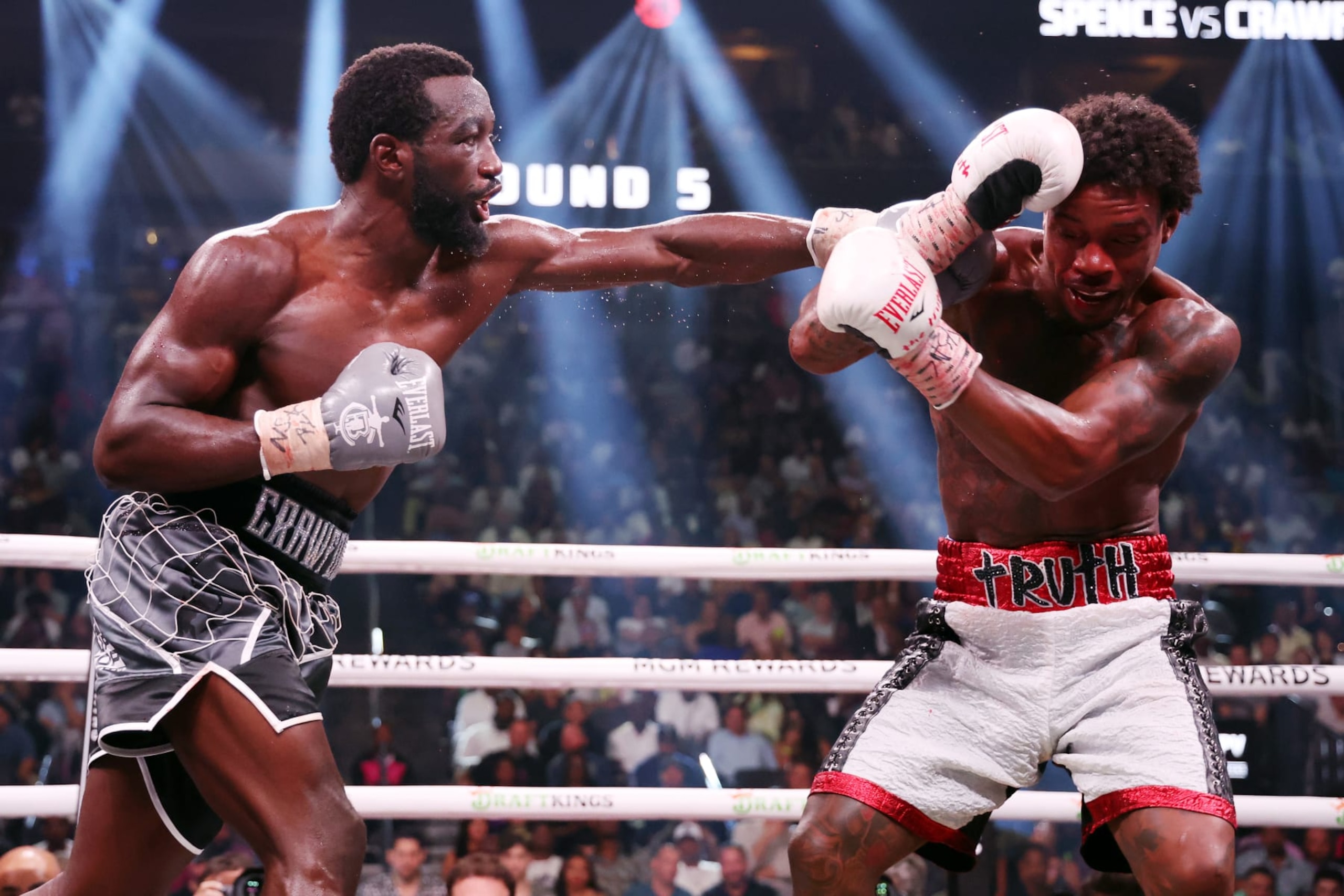 LAS VEGAS, NEVADA - JULY 29: Terrence Crawford punches Errol Spence Jr. during round 5 of the World Welterweight Championship bout at T-Mobile Arena on July 29, 2023 in Las Vegas, Nevada. (Photo by Al Bello/Getty Images)
