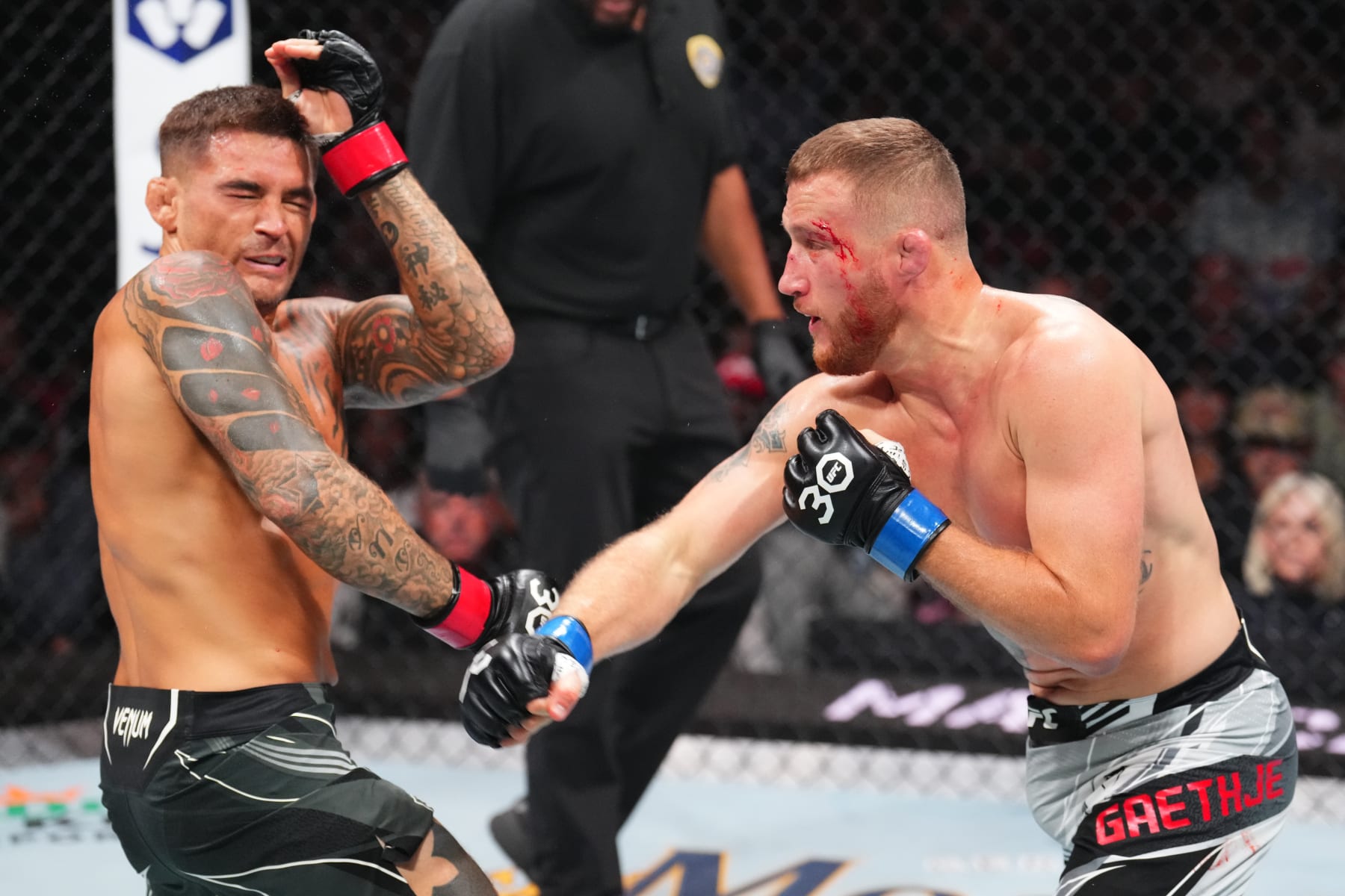 SALT LAKE CITY, UTAH - JULY 29: (R-L) Justin Gaethje punches Dustin Poirier in a lightweight fight for the BMF belt during the UFC 291 event at Delta Center on July 29, 2023 in Salt Lake City, Utah. (Photo by Josh Hedges/Zuffa LLC via Getty Images)