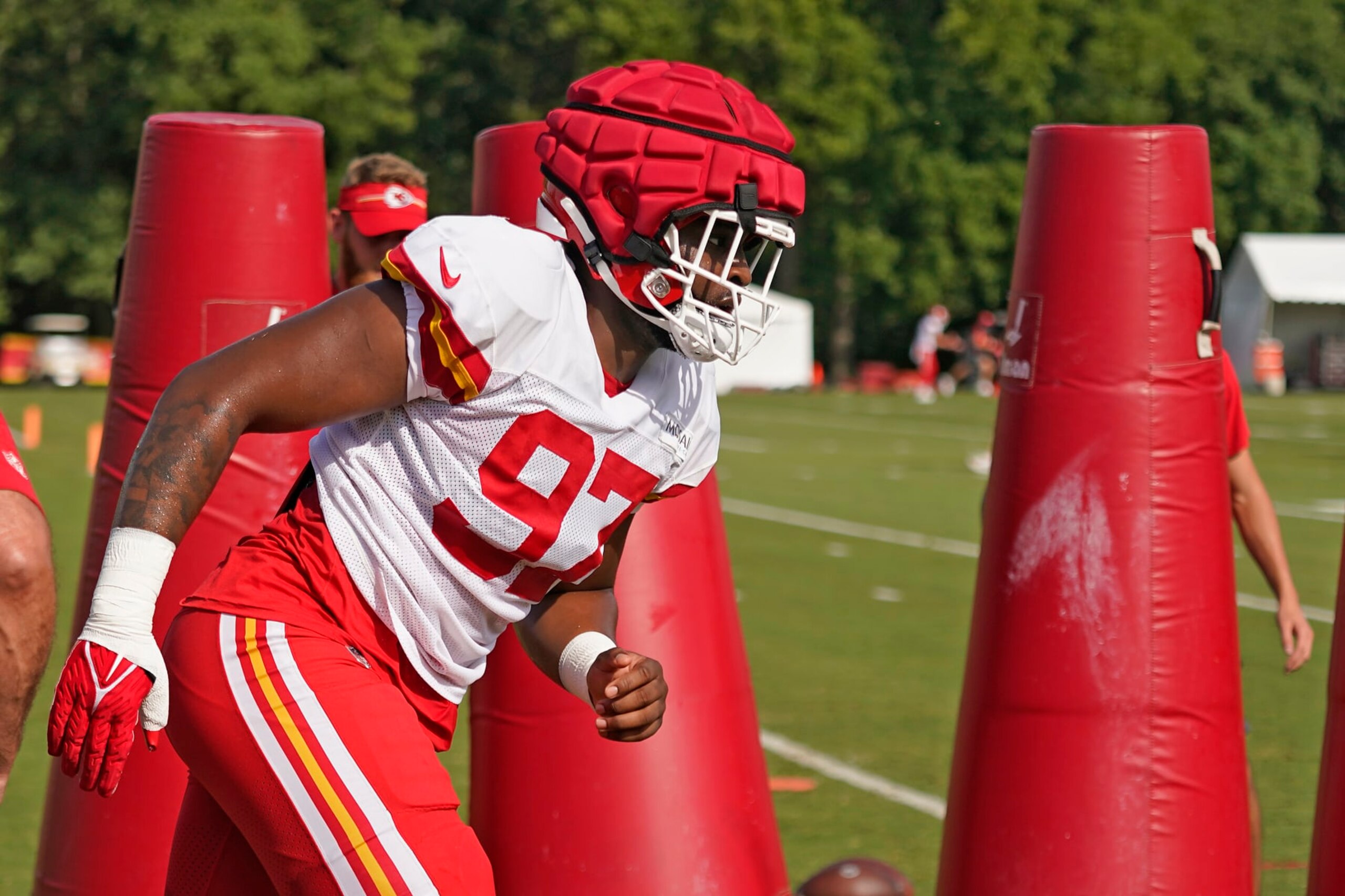 Kansas City Chiefs defensive end Felix Anudike-Uzomah participates in a drill during NFL football training camp Saturday, July 29, 2023, in St. Joseph, Mo. (AP Photo/Charlie Riedel)