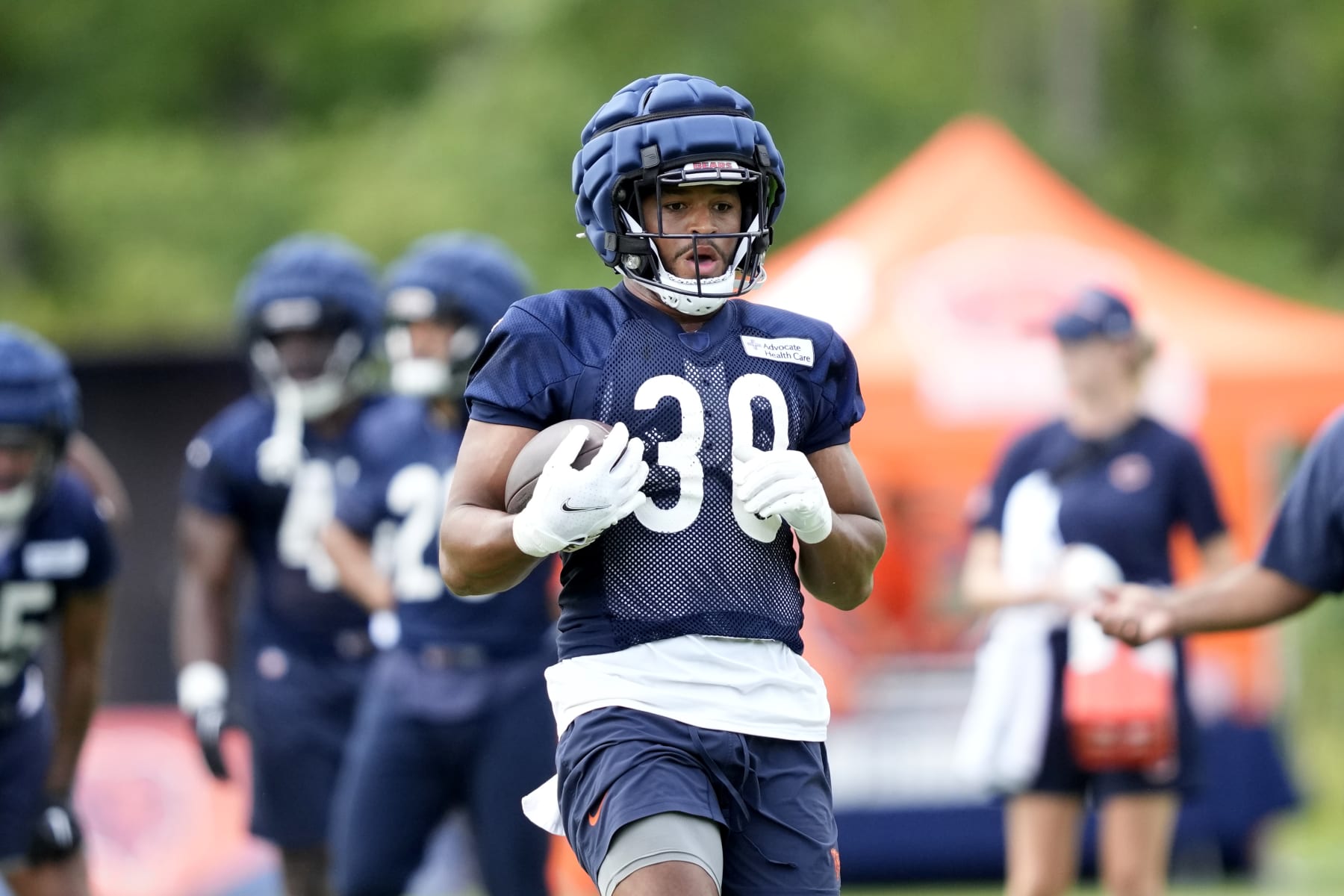 Chicago Bears running back Roschon Johnson participates in the NFL football team's Back Together training camp event for fans on Saturday, July 29, 2023, in Lake Forest , Ill. (AP Photo/Charles Rex Arbogast)
