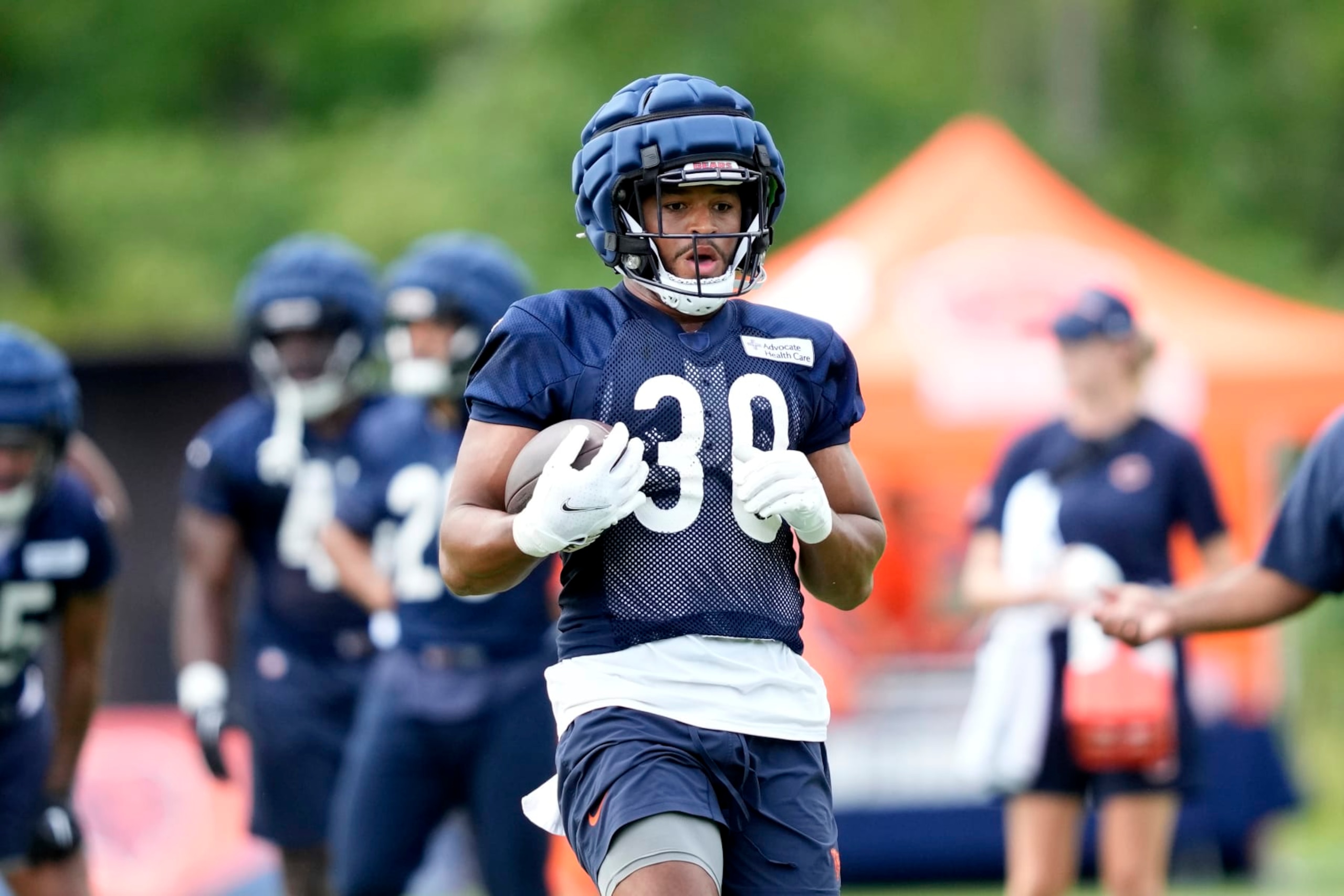 Chicago Bears running back Roschon Johnson participates in the NFL football team's Back Together training camp event for fans on Saturday, July 29, 2023, in Lake Forest , Ill. (AP Photo/Charles Rex Arbogast)