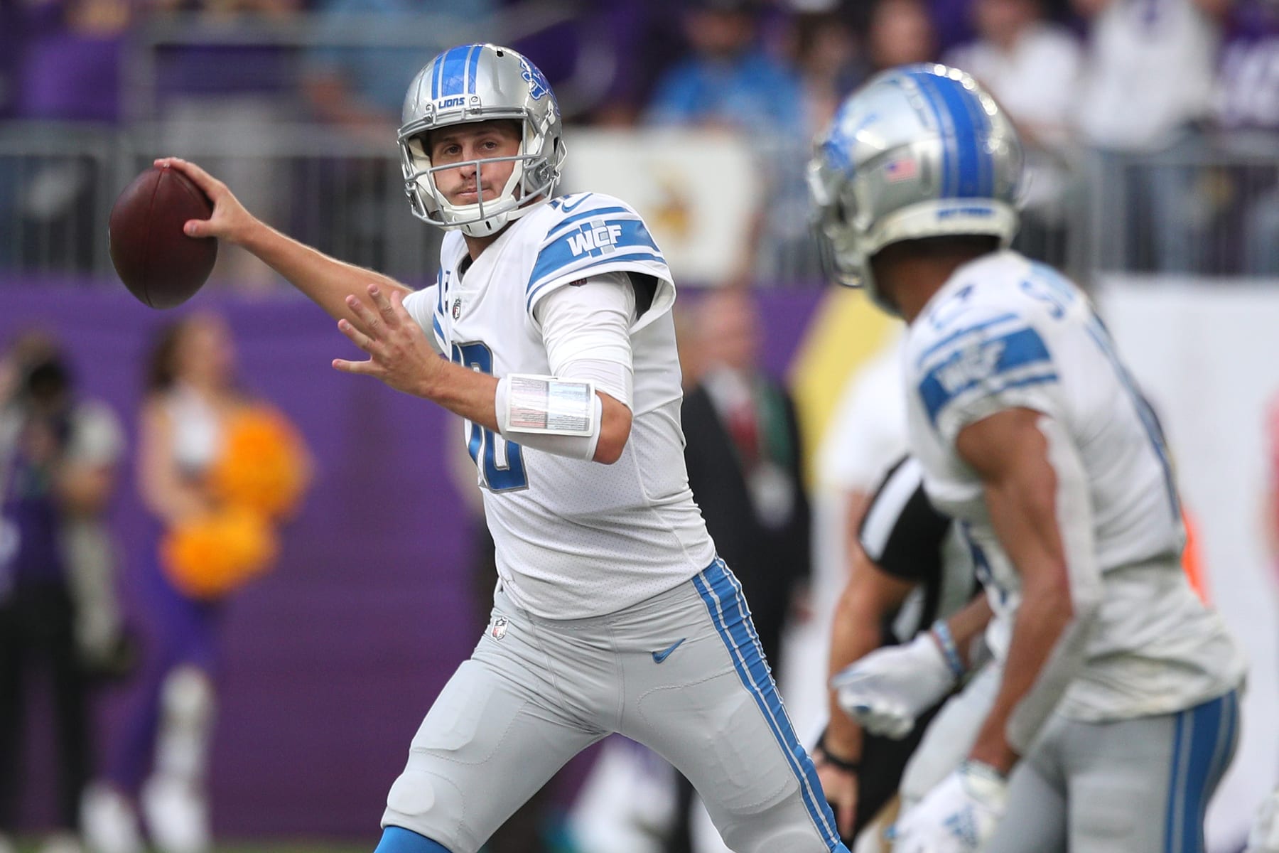 MINNEAPOLIS, MINNESOTA - OCTOBER 10: Jared Goff #16 of the Detroit Lions throws the ball to Amon-Ra St. Brown #14 during the second quarter against the Minnesota Vikings at U.S. Bank Stadium on October 10, 2021 in Minneapolis, Minnesota. (Photo by David Berding/Getty Images)