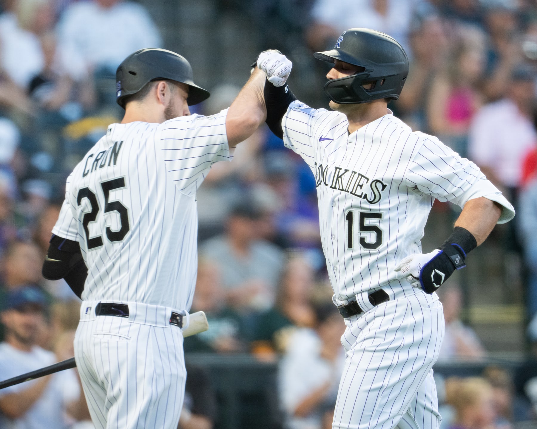 DENVER, COLORADO - JULY 28: Randal Grichuk #15 of the Colorado Rockies celebrates with teammate C.J. Cron #25 after hitting a home run against the Oakland Athletics at Coors Field on July 28, 2023 in Denver, Colorado. (Photo by Kyle Cooper/Colorado Rockies/Getty Images)