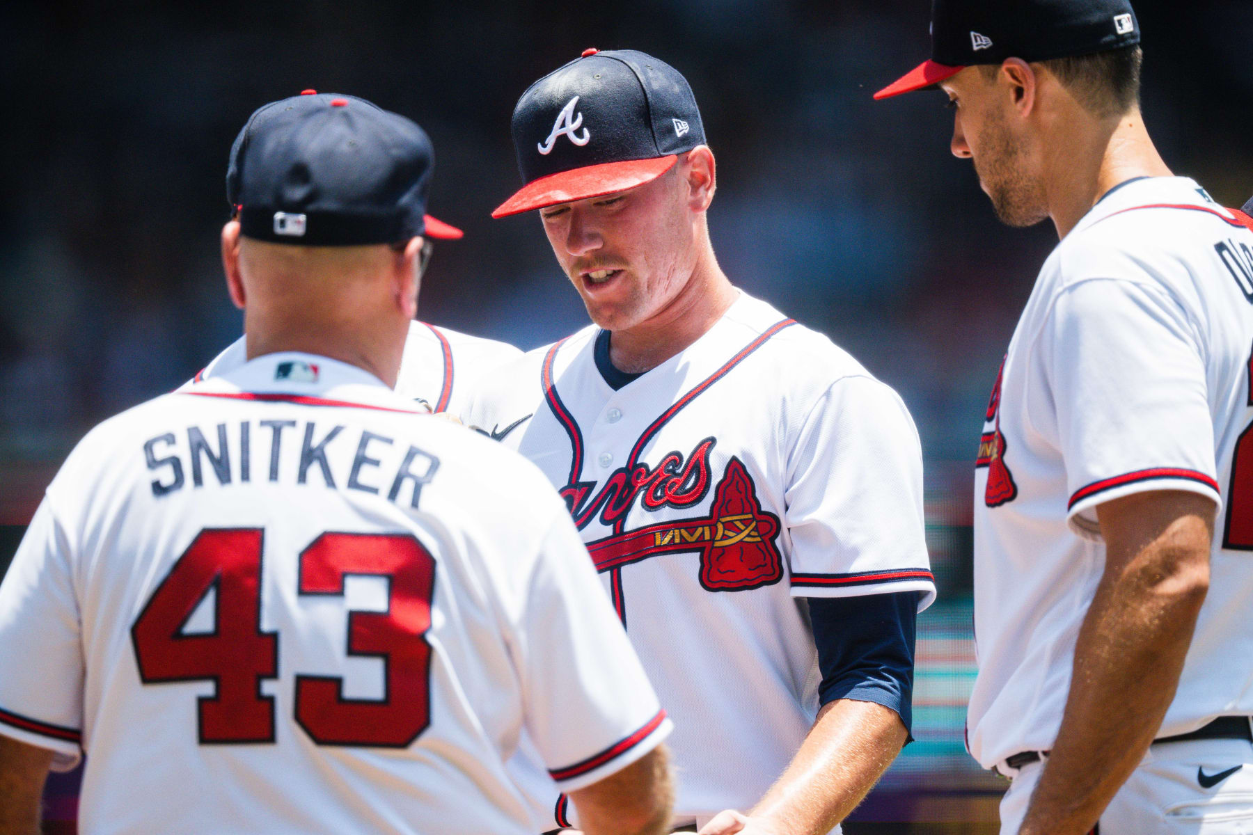 ATLANTA, GA - JUNE 28: Kolby Allard #49 of the Atlanta Braves heads to the dugout after Brian Snitker #43 takes him out during the game against the Minnesota Twins at Truist Park on June 28, 2023 in Atlanta, Georgia. (Photo by Kevin D. Liles/Atlanta Braves/Getty Images)