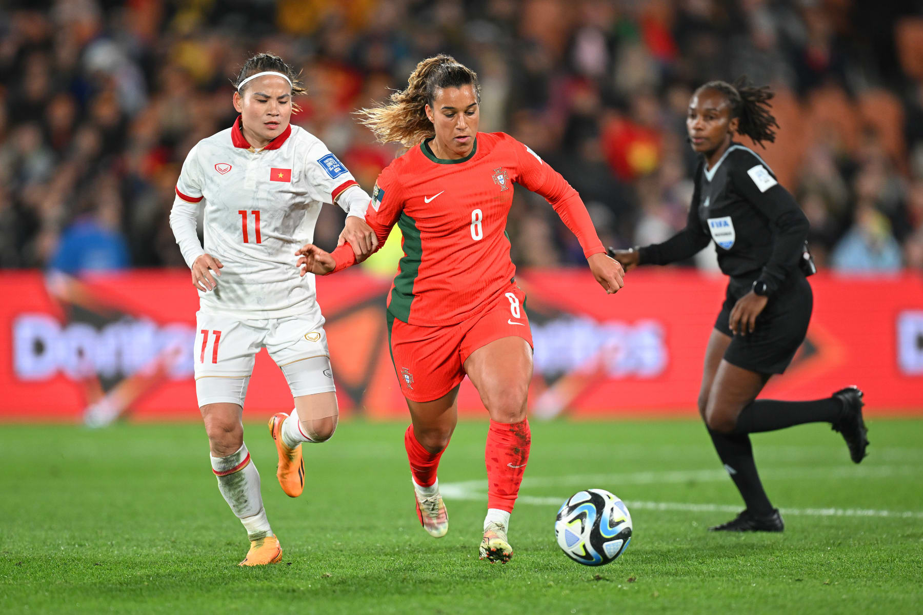 HAMILTON, NEW ZEALAND - JULY 27: Andreia Norton of Portugal  controls the ball against Thai Thi Thao of Vietnam during the FIFA Women's World Cup Australia & New Zealand 2023 Group E match between Portugal and Vietnam at Waikato Stadium on July 27, 2023 in Hamilton / Kirikiriroa, New Zealand. (Photo by Hannah Peters - FIFA/FIFA via Getty Images)