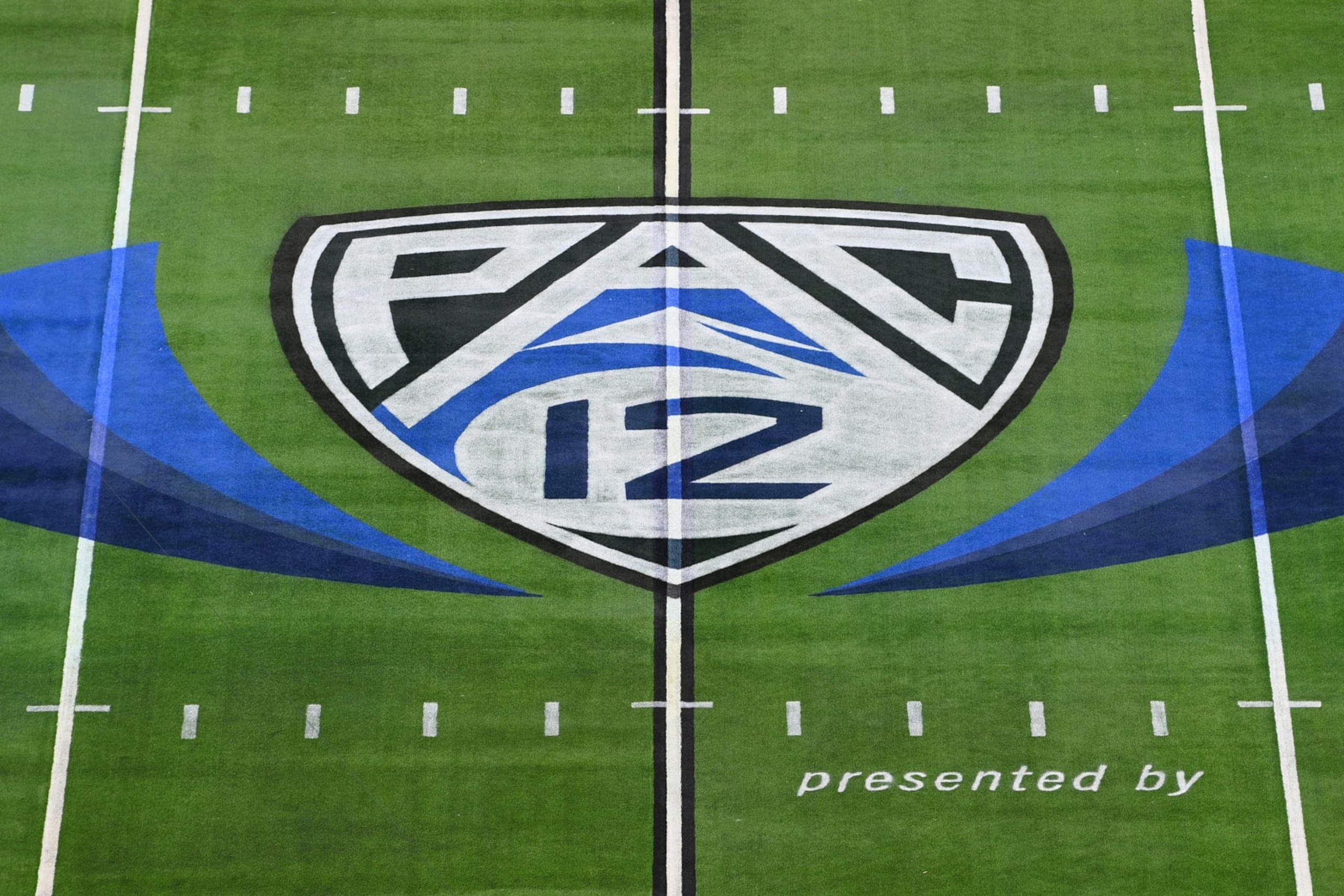 LAS VEGAS, NV - DECEMBER 02: A view of the Pac-12 logo on the field before the Pac-12 Conference championship game between the Utah Utes and the USC Trojans at Allegiant Stadium on December 2, 2022 in Las Vegas, Nevada. (Photo by Brian Rothmuller/Icon Sportswire via Getty Images) LAS VEGAS, NV - DECEMBER 02: A view of the Pac-12 logo on the field before the Pac-12 Conference championship game between the Utah Utes and the USC Trojans at Allegiant Stadium on December 2, 2022 in Las Vegas, Nevada. (Photo by Brian Rothmuller/Icon Sportswire via Getty Images)