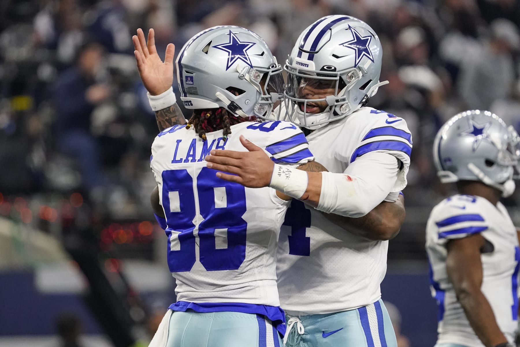 ARLINGTON, TEXAS - DECEMBER 24: CeeDee Lamb #88 of the Dallas Cowboys is congratulated by Dak Prescott #4 after scoring a touchdown during the second quarter of a game against the Philadelphia Eagles at AT&T Stadium on December 24, 2022 in Arlington, Texas. (Photo by Sam Hodde/Getty Images)