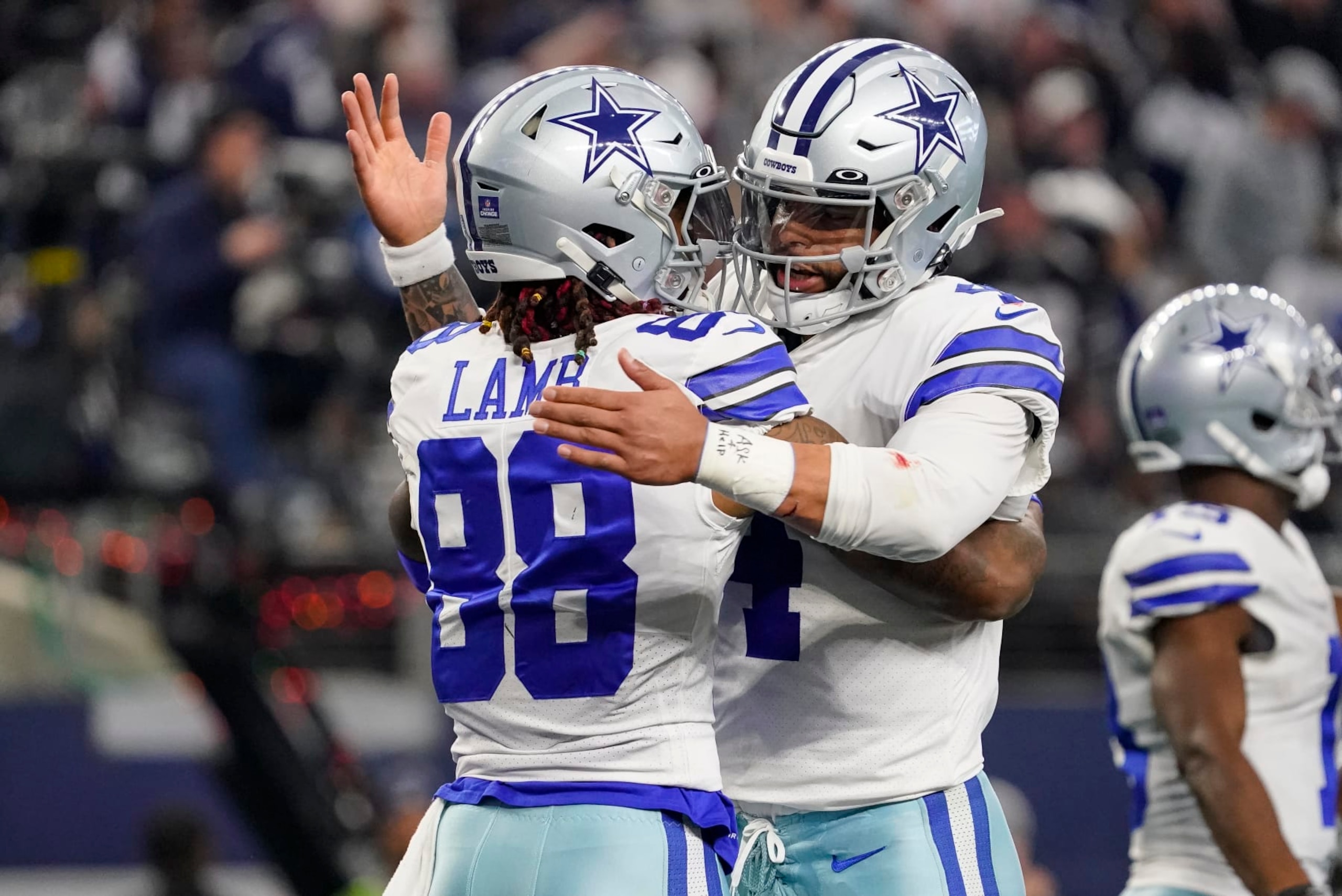 ARLINGTON, TEXAS - DECEMBER 24: CeeDee Lamb #88 of the Dallas Cowboys is congratulated by Dak Prescott #4 after scoring a touchdown during the second quarter of a game against the Philadelphia Eagles at AT&T Stadium on December 24, 2022 in Arlington, Texas. (Photo by Sam Hodde/Getty Images)