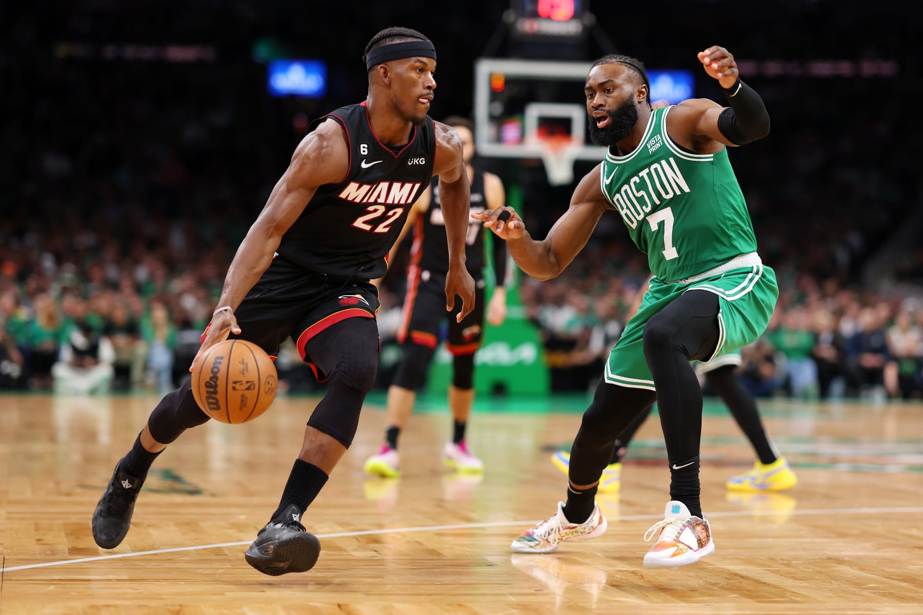 BOSTON, MASSACHUSETTS - MAY 29: Jimmy Butler #22 of the Miami Heat dribbles against Jaylen Brown #7 of the Boston Celtics during the third quarter in game seven of the Eastern Conference Finals at TD Garden on May 29, 2023 in Boston, Massachusetts. NOTE TO USER: User expressly acknowledges and agrees that, by downloading and or using this photograph, User is consenting to the terms and conditions of the Getty Images License Agreement. (Photo by Maddie Meyer/Getty Images)