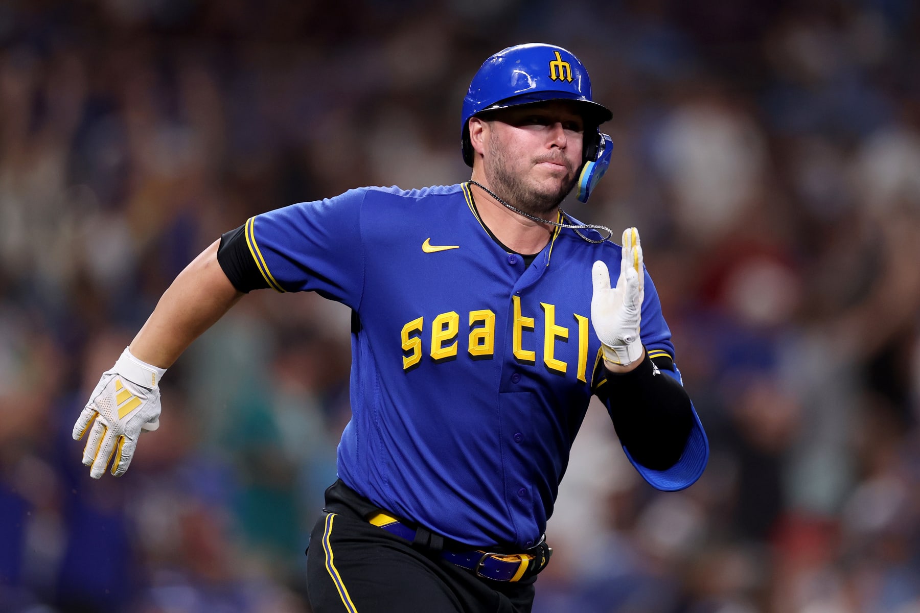 SEATTLE, WASHINGTON - JULY 21: Ty France #23 of the Seattle Mariners runs to first base against the Toronto Blue Jays at T-Mobile Park on July 21, 2023 in Seattle, Washington. (Photo by Steph Chambers/Getty Images)