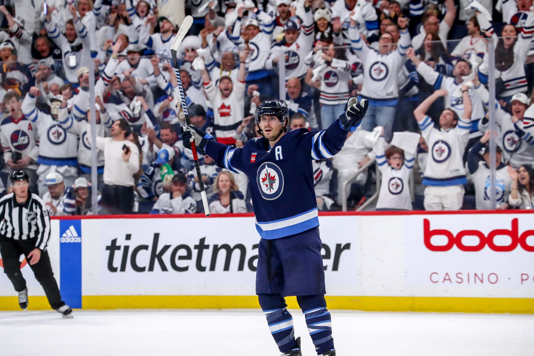 WINNIPEG, CANADA - APRIL 22: Mark Scheifele #55 of the Winnipeg Jets celebrates after scoring a third period goal against the Vegas Golden Knights in Game Three of the First Round of the 2023 Stanley Cup Playoffs at the Canada Life Centre on April 22, 2023 in Winnipeg, Manitoba, Canada. (Photo by Darcy Finley/NHLI via Getty Images)