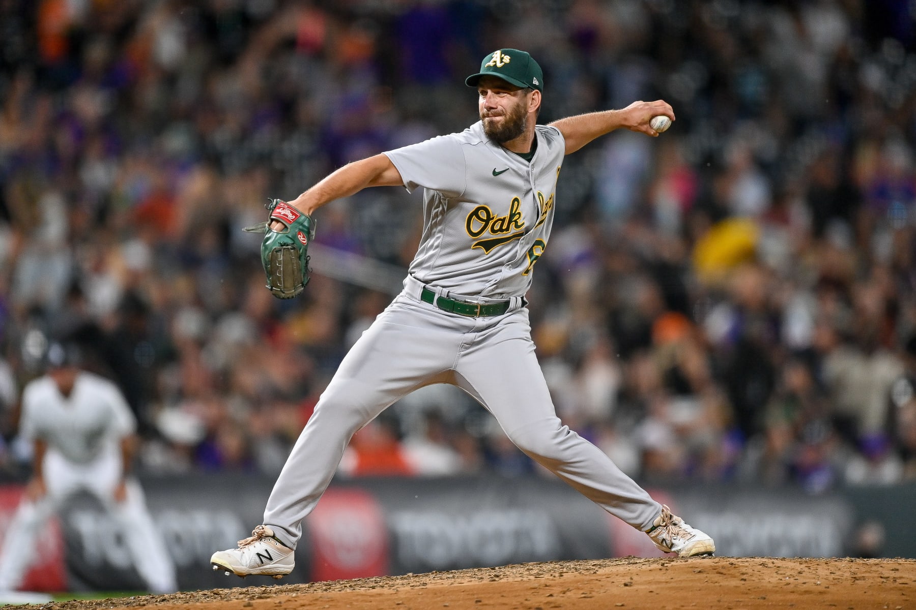 DENVER, CO - JULY 28: Sam Moll #60 of the Oakland Athletics pitches in the seventh inning of a game against the Colorado Rockies at Coors Field on July 28, 2023 in Denver, Colorado. (Photo by Dustin Bradford/Getty Images)