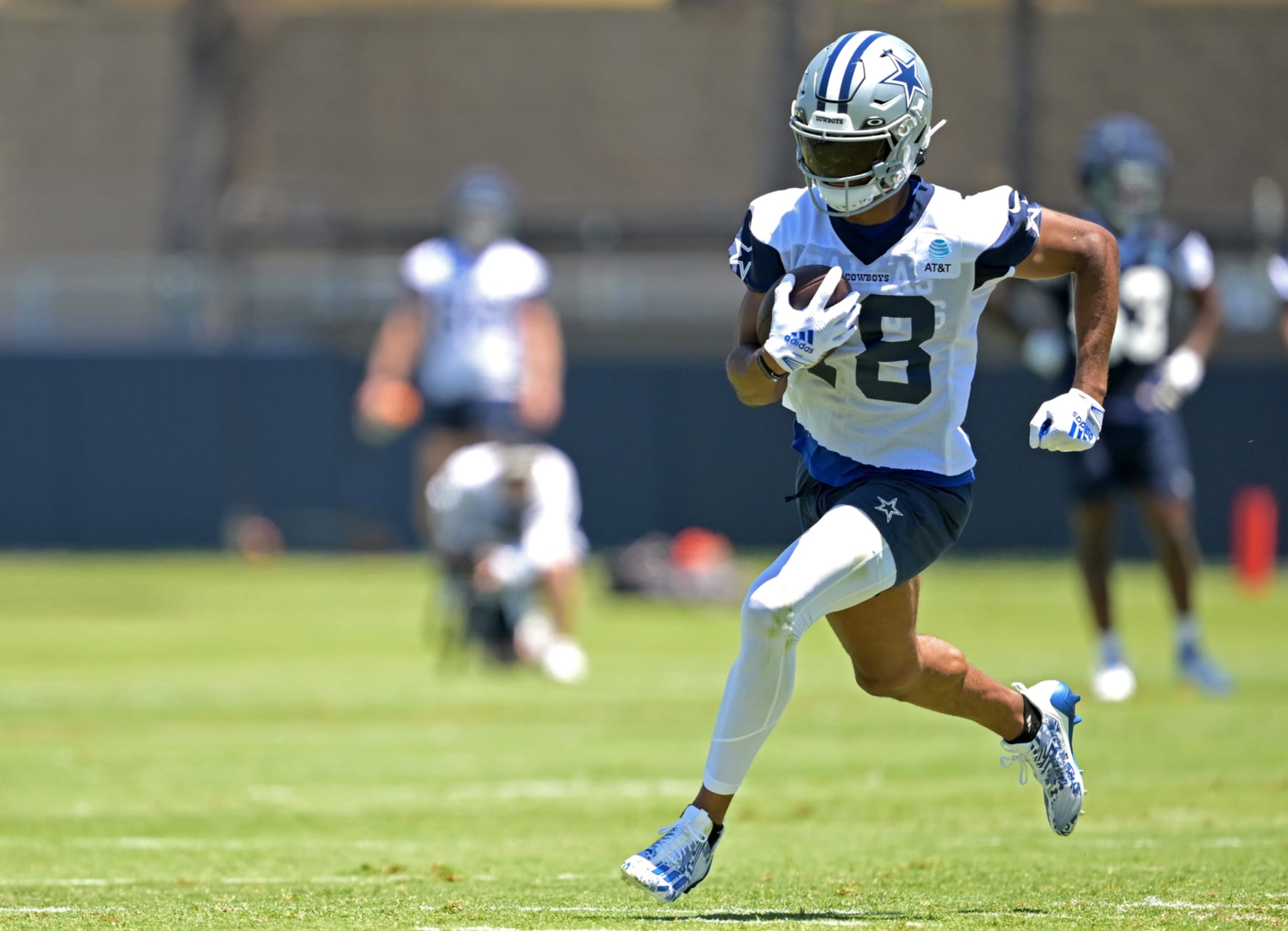 OXNARD, CALIFORNIA - JULY 27  Wide receiver Jalen Tolbert #18 of the Dallas Cowboys carries the ball during training camp at River Ridge Playing Fields on July 27, 2023 in Oxnard, California. (Photo by Jayne Kamin-Oncea/Getty Images)