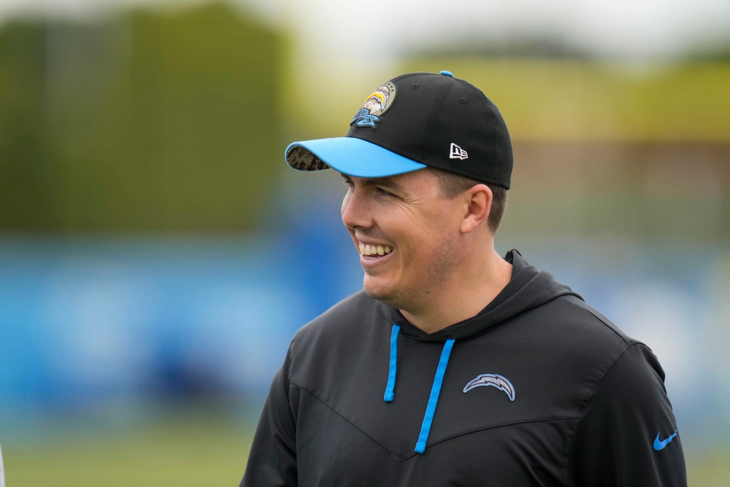 Los Angeles Chargers offensive coordinator Kellen Moore walks on the field during the NFL football team's camp Wednesday, May 31, 2023, in Costa Mesa, Calif. (AP Photo/Jae C. Hong)