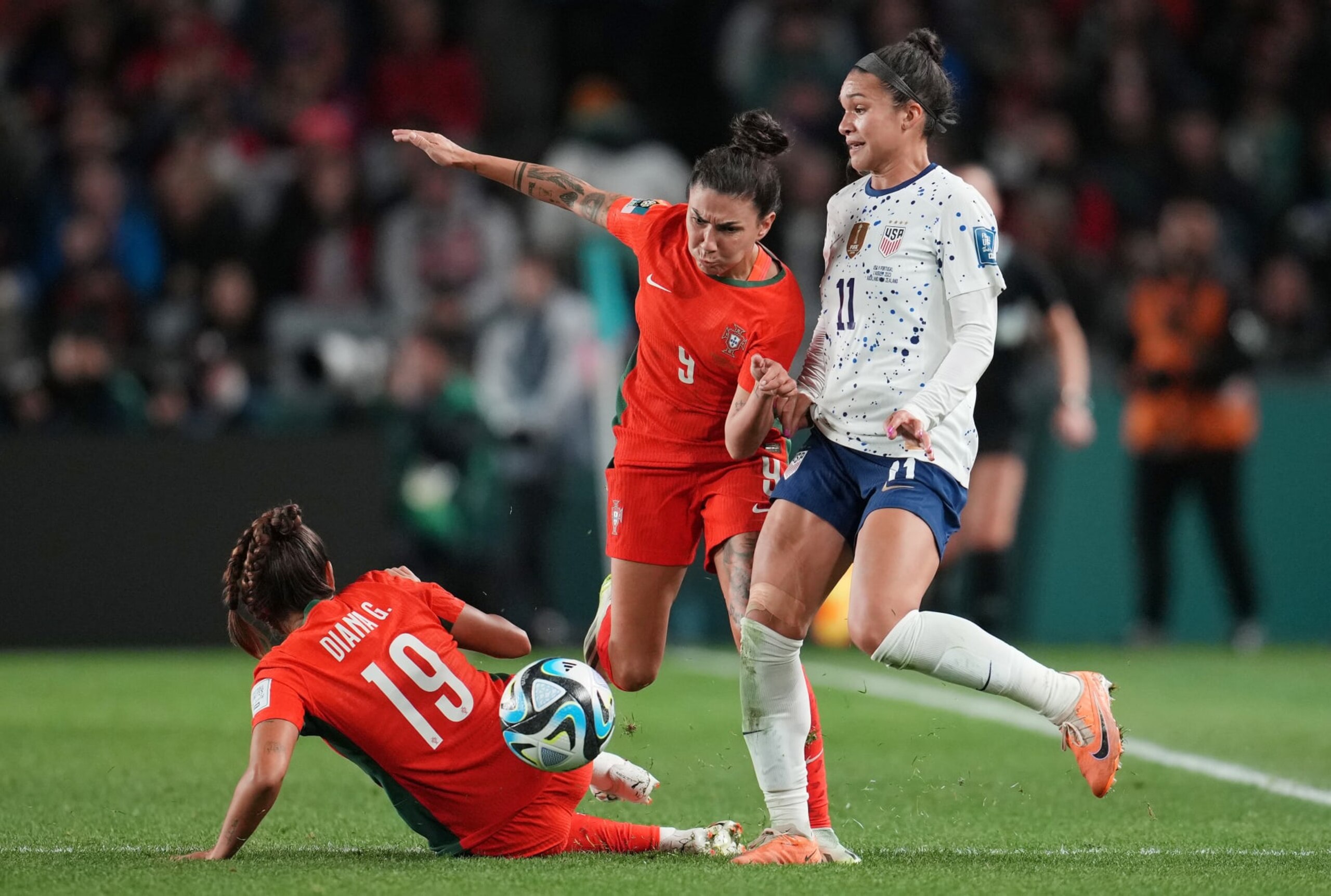 AUCKLAND, NEW ZEALAND - AUGUST 01: Sophia Smith #11 of the United States battles for the ball with Diana Gomes #19 and Ana Borges #9 of Portugal during the first half of the FIFA Women's World Cup Australia & New Zealand 2023 Group E match between Portugal and USA at Eden Park on August 01, 2023 in Auckland, New Zealand. (Photo by Brad Smith/USSF/Getty Images)