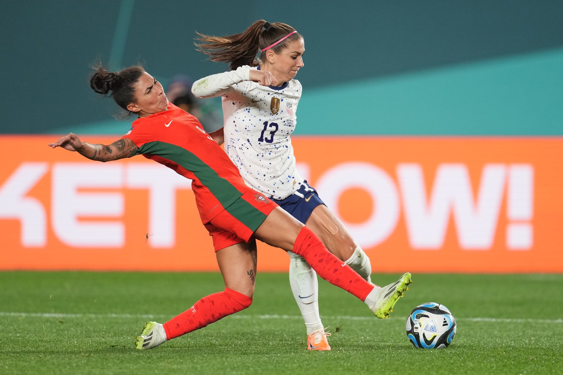 AUCKLAND, NEW ZEALAND - AUGUST 01: Alex Morgan #13 of the United States is defended by Ana Borges #9 of Portugal during the second half of the FIFA Women's World Cup Australia & New Zealand 2023 Group E match between Portugal and USA at Eden Park on August 01, 2023 in Auckland, New Zealand. (Photo by Brad Smith/USSF/Getty Images)