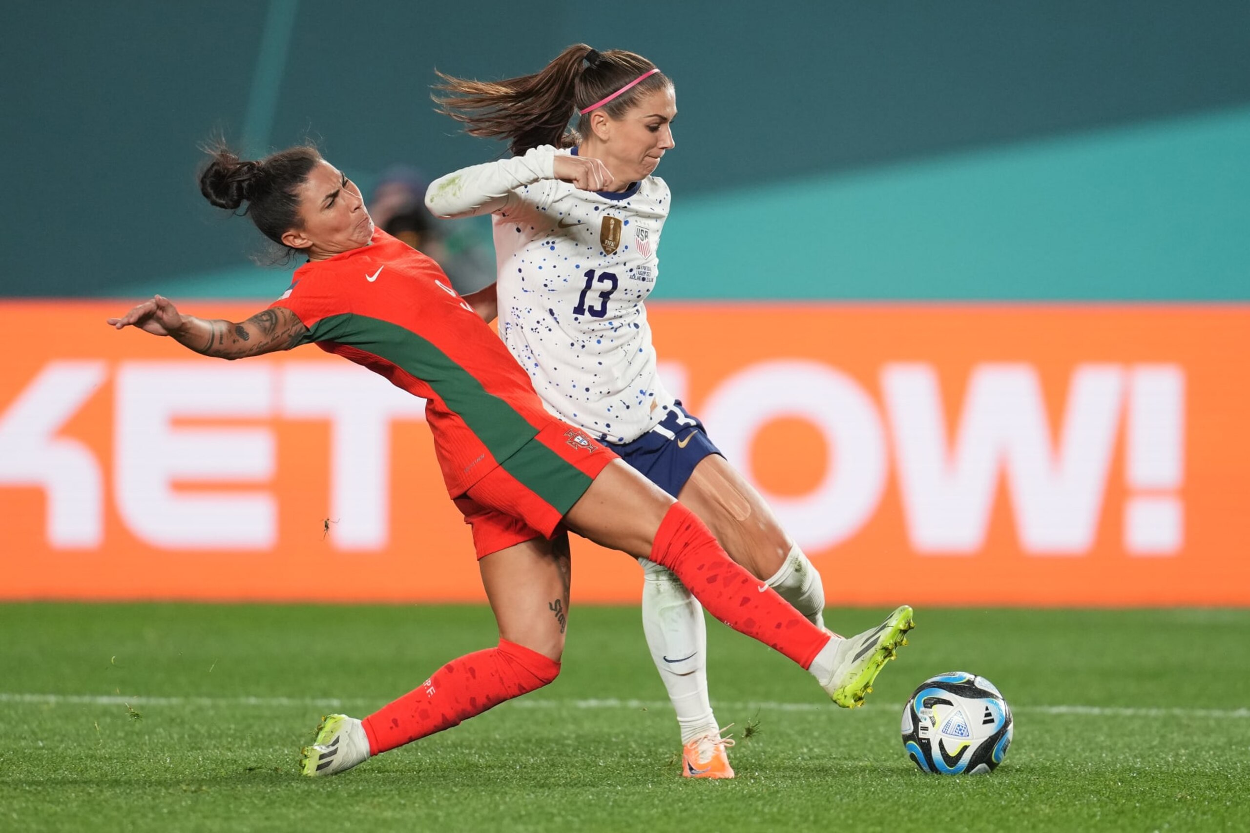 AUCKLAND, NEW ZEALAND - AUGUST 01: Alex Morgan #13 of the United States is defended by Ana Borges #9 of Portugal during the second half of the FIFA Women's World Cup Australia & New Zealand 2023 Group E match between Portugal and USA at Eden Park on August 01, 2023 in Auckland, New Zealand. (Photo by Brad Smith/USSF/Getty Images)