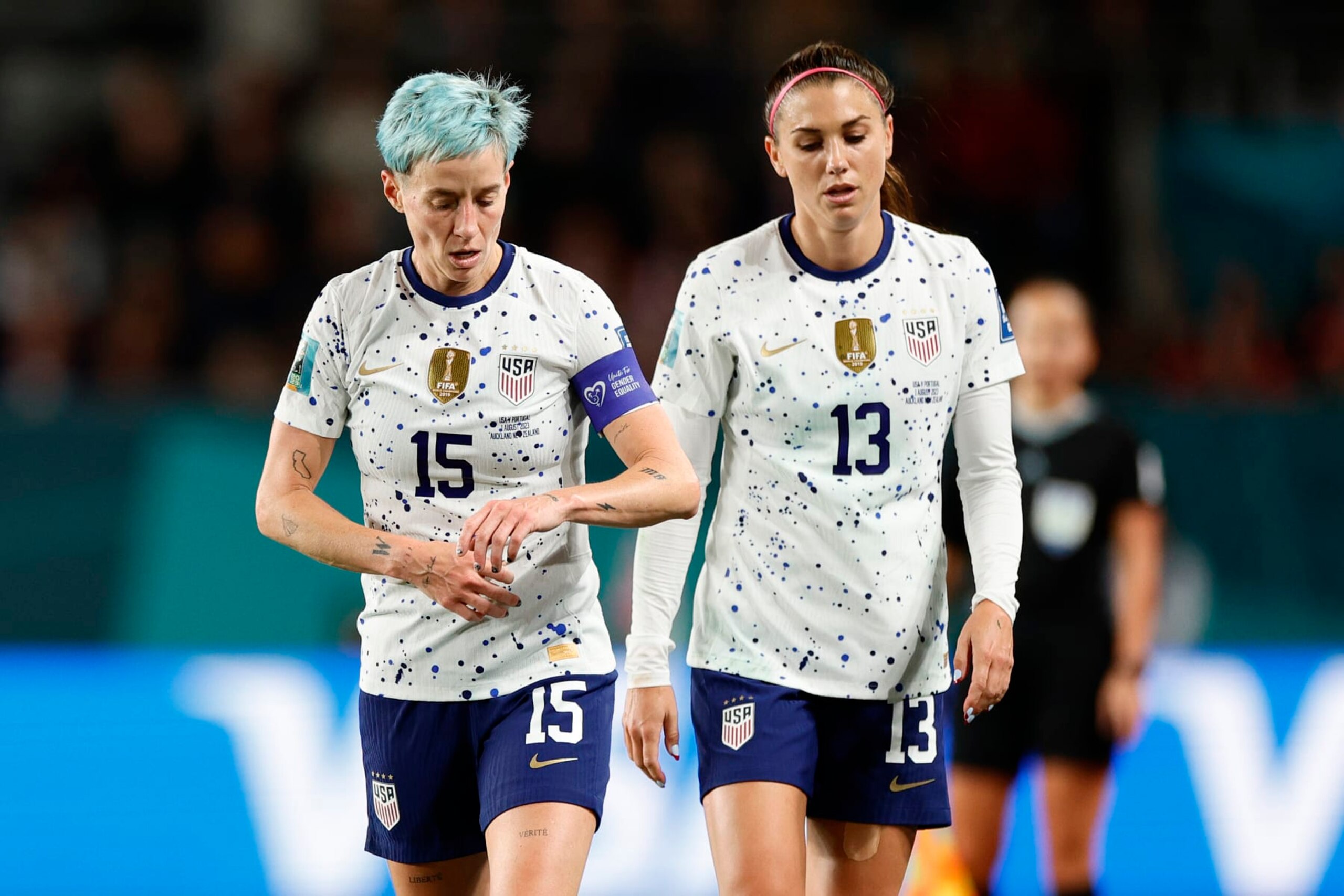 AUCKLAND, NEW ZEALAND - AUGUST 01: Megan Rapinoe #15 and Alex Morgan #13 of the United States during the second half of the FIFA Women's World Cup Australia & New Zealand 2023 Group E match between Portugal and USA at Eden Park on August 01, 2023 in Auckland, New Zealand. (Photo by Carmen Mandato/USSF/Getty Images )