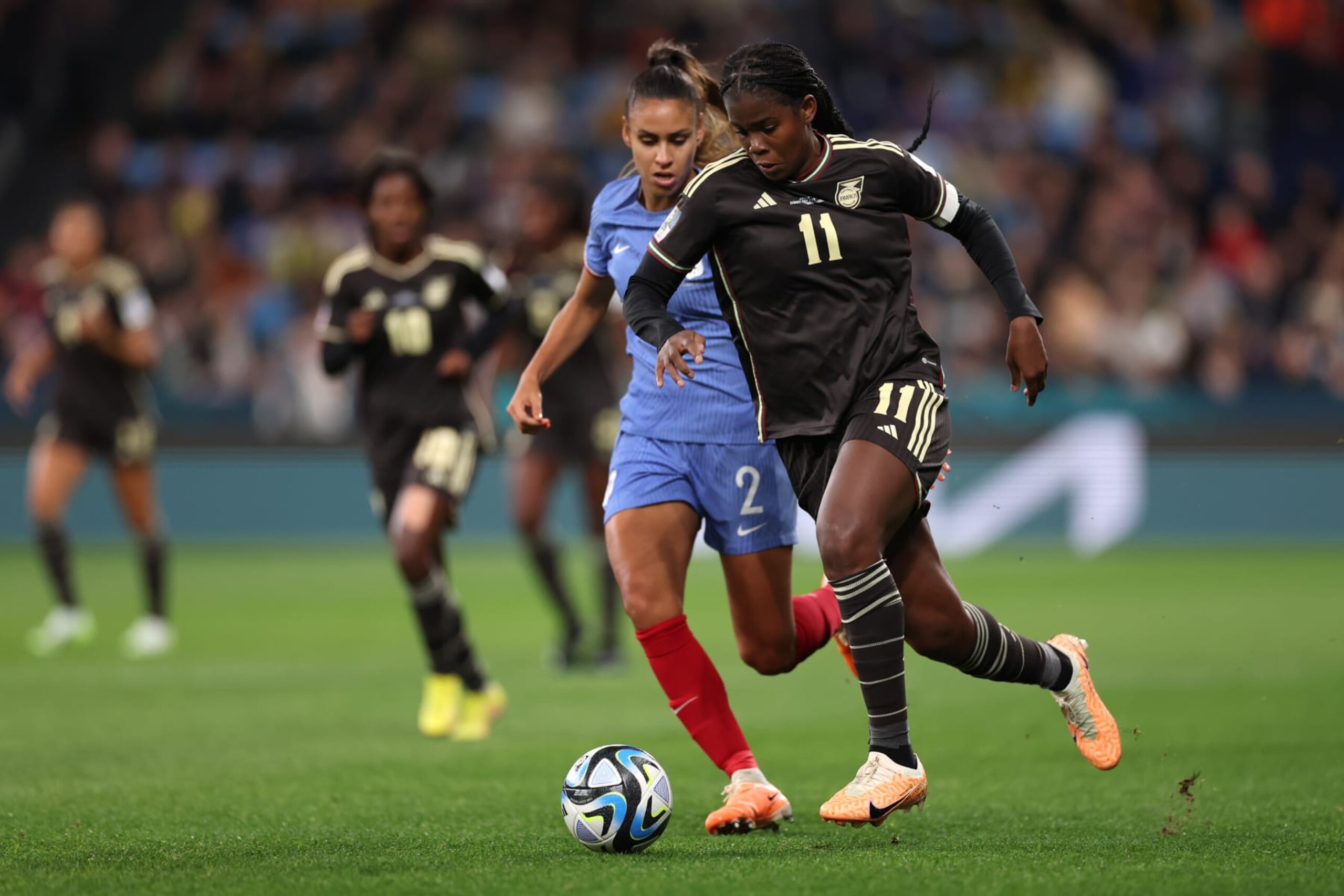 SYDNEY, AUSTRALIA - JULY 23: Khadija Shaw of Jamaica dribbles past Maelle Lakrar of France  during the FIFA Women's World Cup Australia & New Zealand 2023 Group F match between France and Jamaica at Sydney Football Stadium on July 23, 2023 in Sydney, Australia. (Photo by Maddie Meyer - FIFA/FIFA via Getty Images)