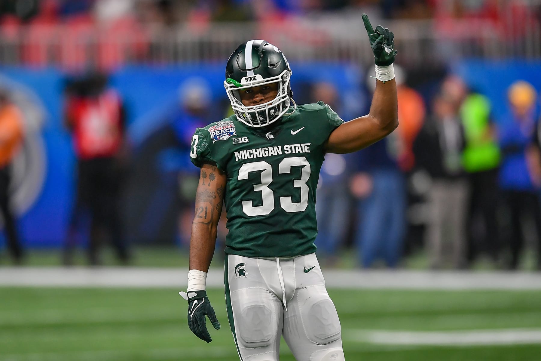 ATLANTA, GA  DECEMBER 30:  Michigan State cornerback Kendell Brooks (33) reacts during the Chick-fil-A Peach Bowl between the Michigan State Spartans and Pittsburgh Panthers on December 30th, 2021 at Mercedes Benz Stadium in Atlanta, GA.  (Photo by Rich von Biberstein/Icon Sportswire via Getty Images)