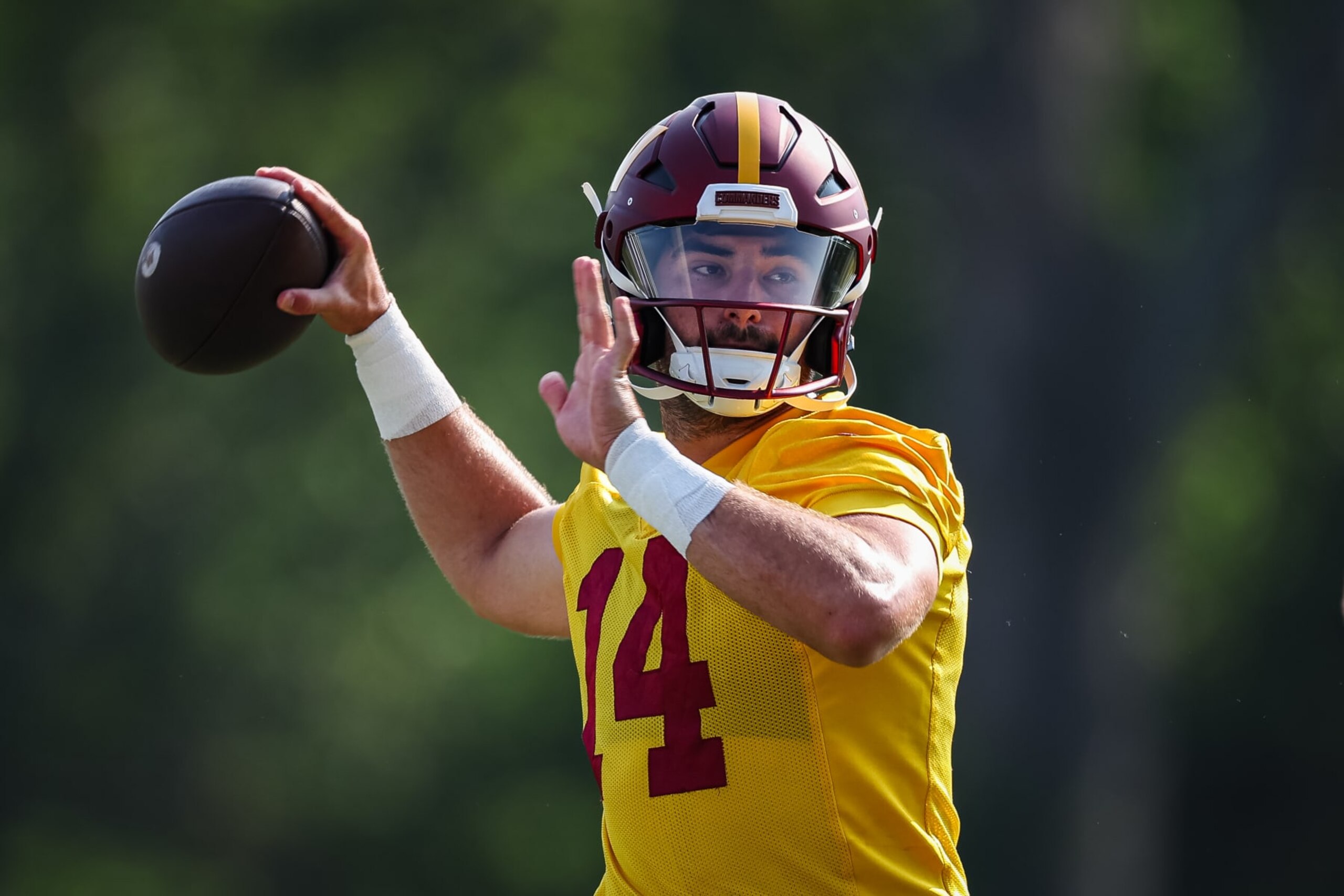 ASHBURN, VA - JULY 28: Sam Howell #14 of the Washington Commanders attempts a pass during training camp at OrthoVirginia Training Center on July 28, 2022 in Ashburn, Virginia. (Photo by Scott Taetsch/Getty Images)